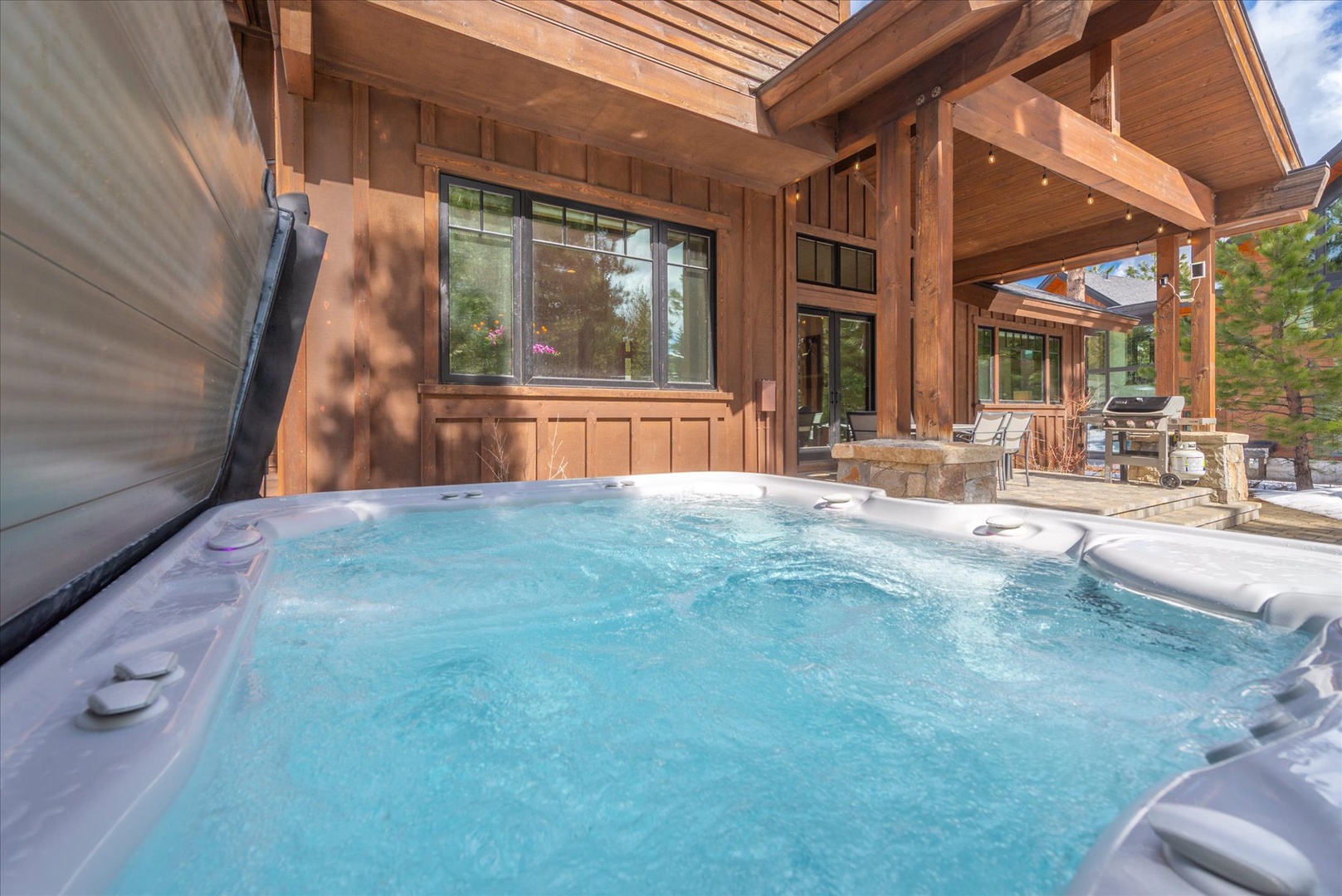 Soak your cares away in this bubbling hot tub, perfectly positioned off your private deck with mountain lodge charm surrounding you.