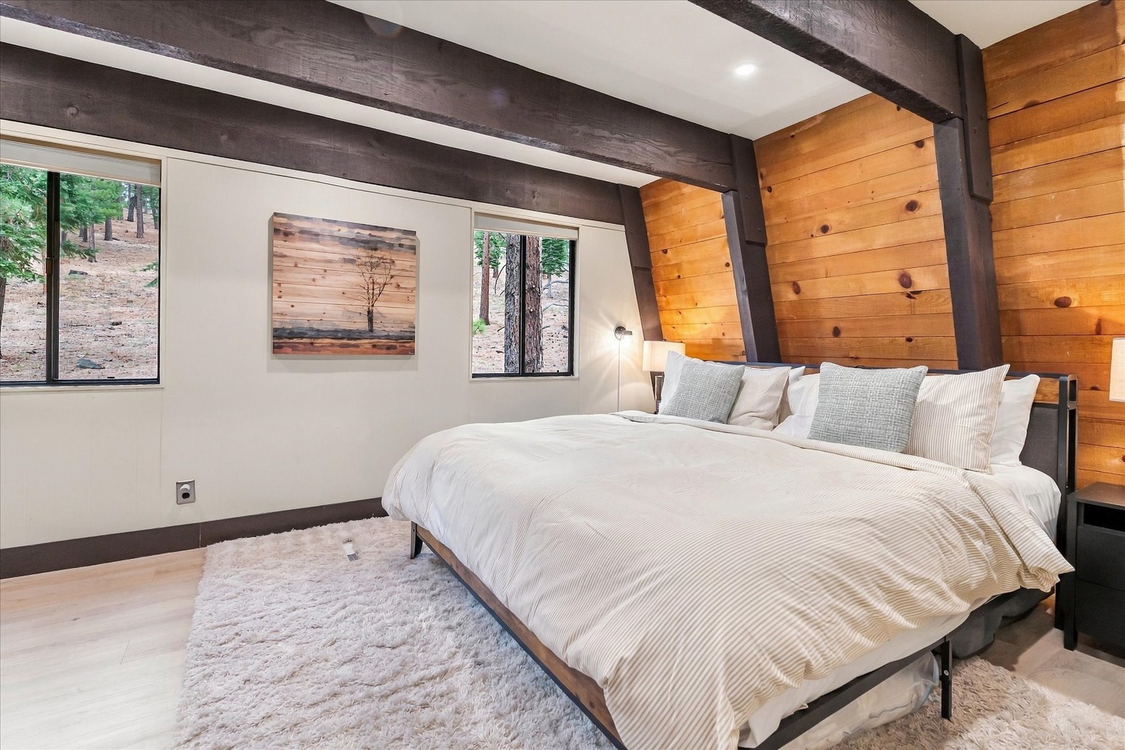 Sink into the plush bedding of your spacious king bed and let the exposed wood beams and forest views through your windows lull you into complete relaxation.