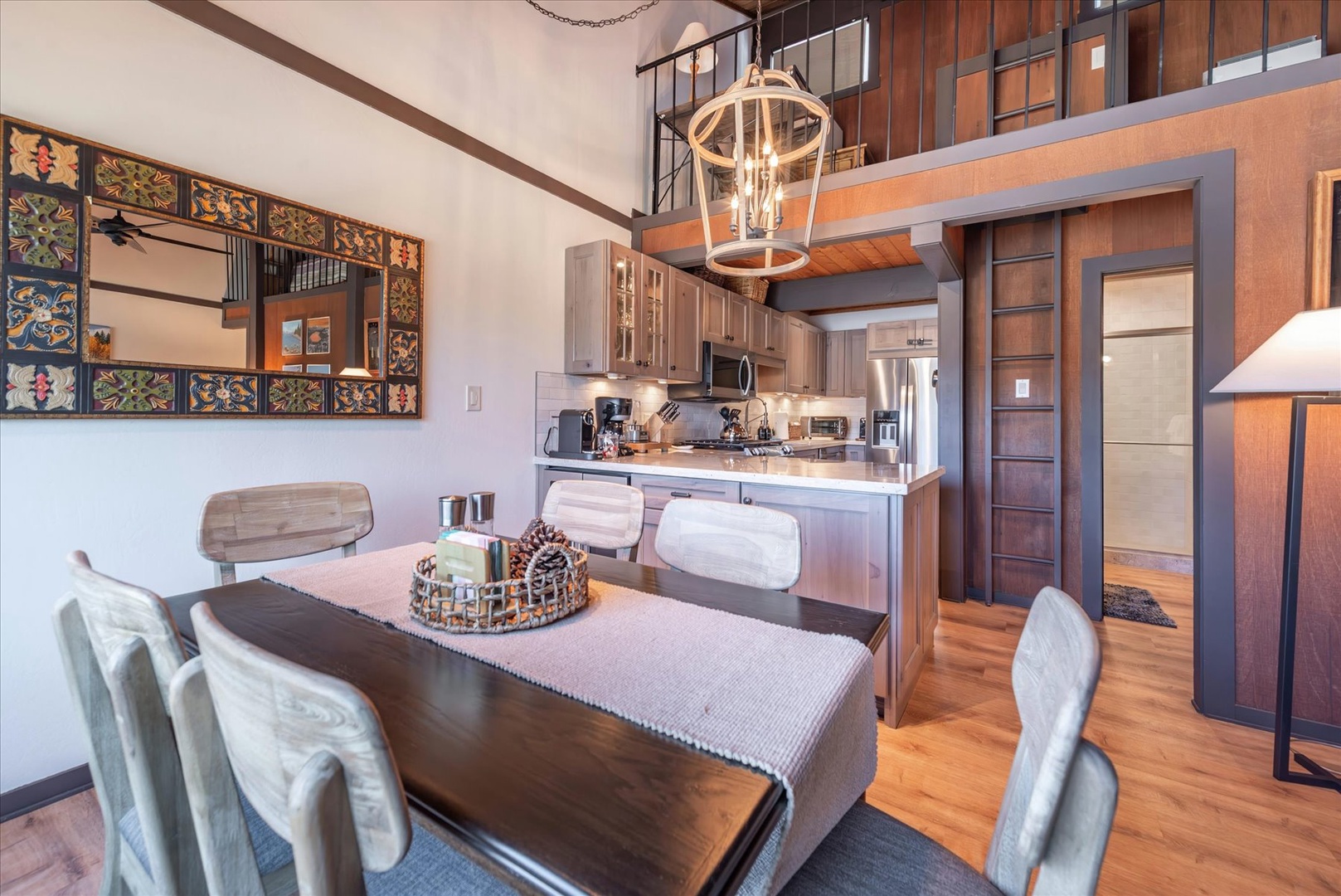 Your stylish loft features an open dining area flowing seamlessly into a modern kitchen, perfect for memorable meals together.