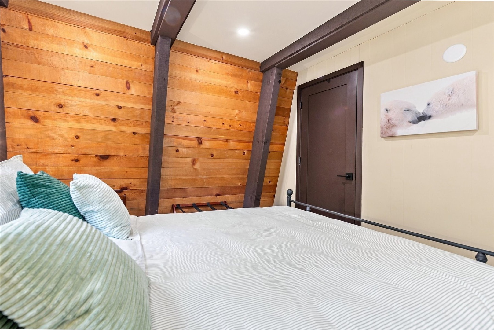 Sink into crisp linens surrounded by warm wood paneling and thoughtful design details that make your alpine retreat feel cozy and personal.