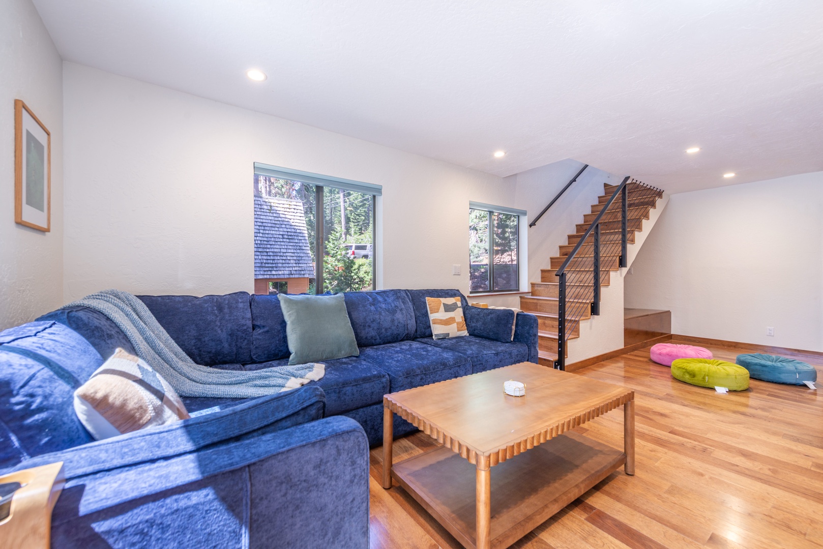 Settle into the plush sectional and let your worries melt away in this bright, airy downstairs living space.