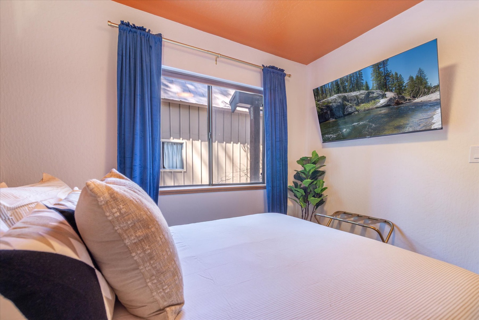 Enjoy restful nights in your comfy queen bedroom with your own smart TV.