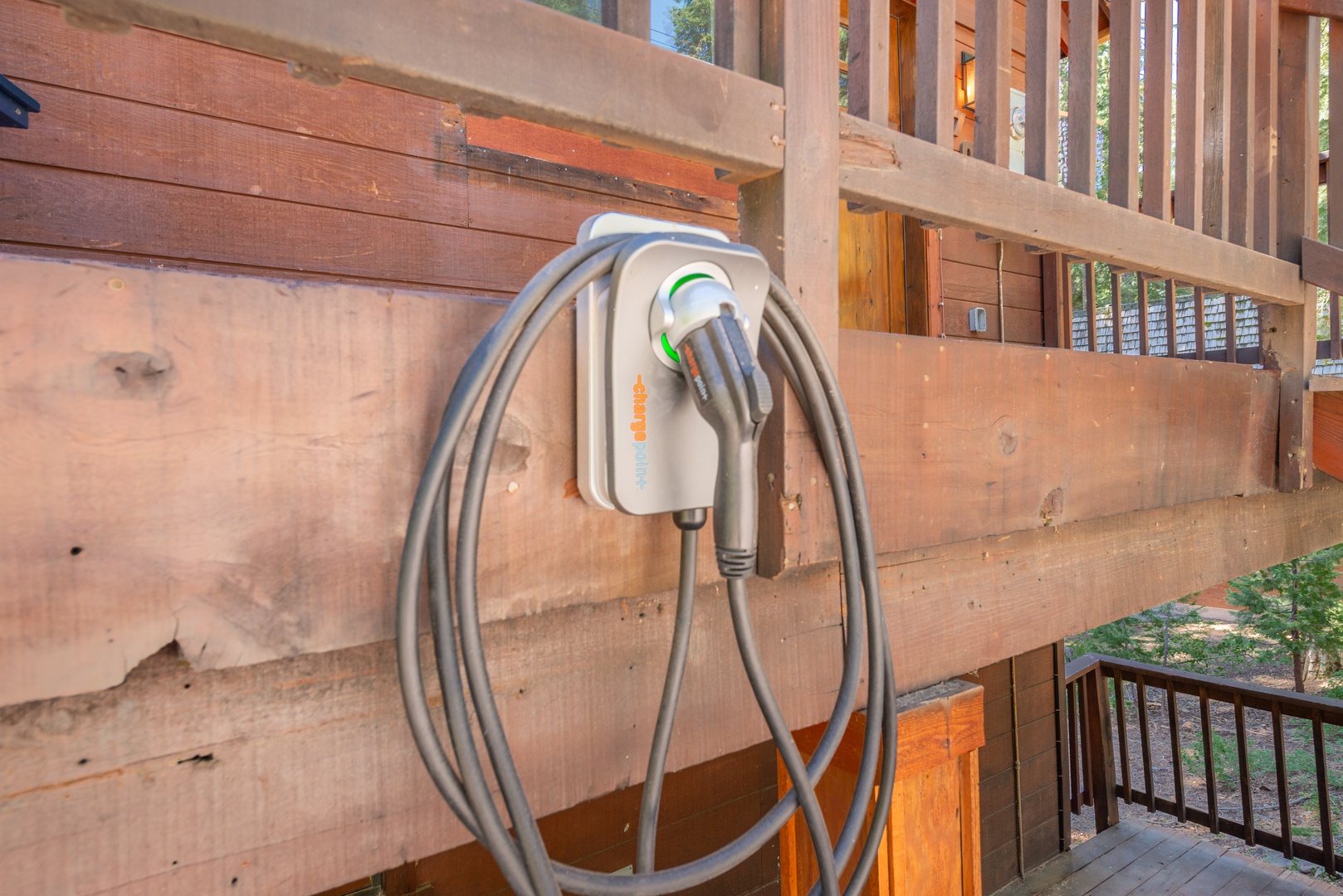 An electric vehicle charging station is conveniently mounted on the exterior, offering easy access for environmentally conscious travelers during their stay.