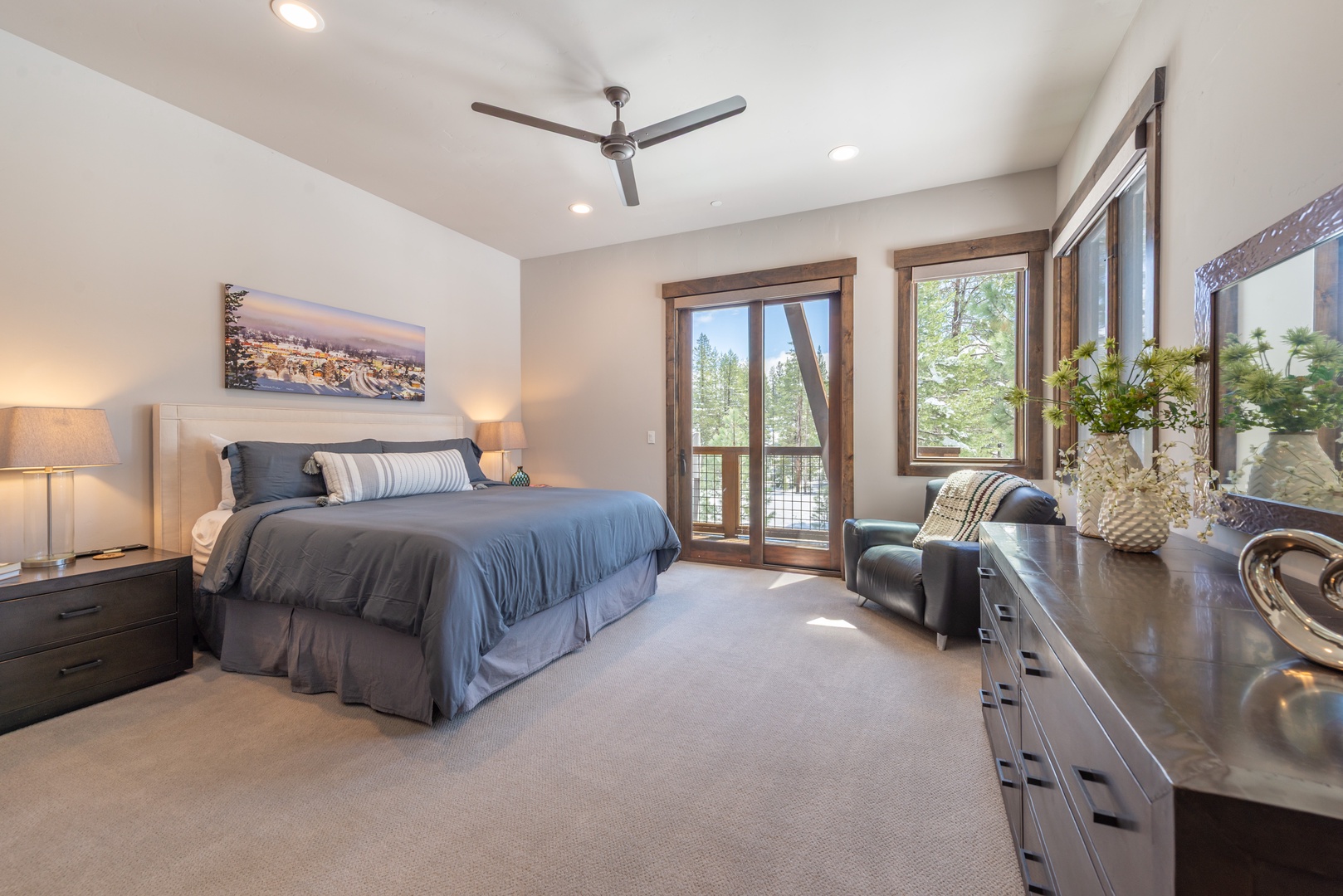 Rest peacefully in your elegant bedroom with plush bedding, forest views from your private balcony, and tranquil ambiance.