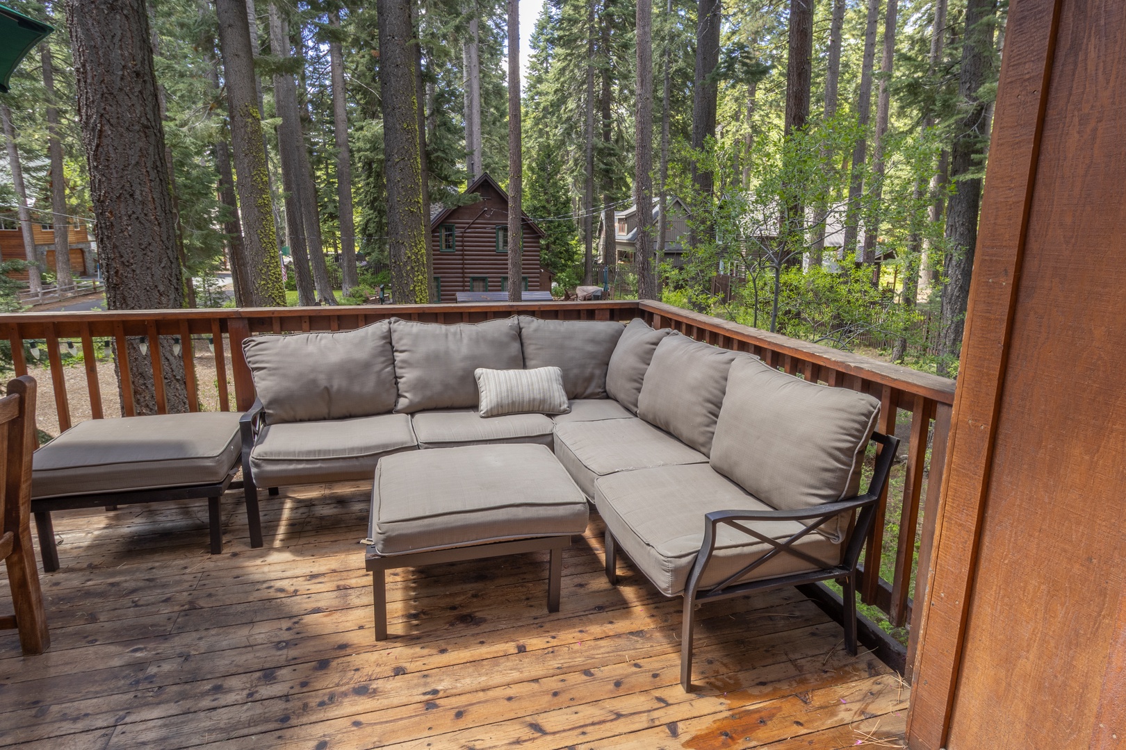 Relax in style on this outdoor sectional sofa, perfectly positioned on a private deck with a backdrop of majestic Tahoe pines.