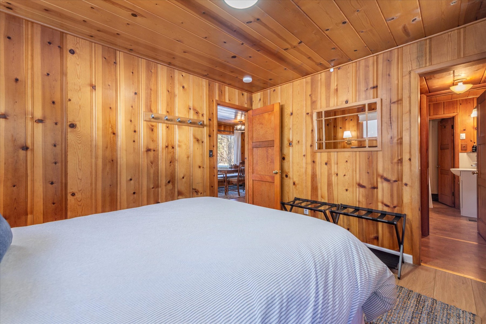 Be right at home in the mountains while you unwind in your pine bedroom, where warm wood surrounds you in rustic comfort and peaceful sleep awaits.