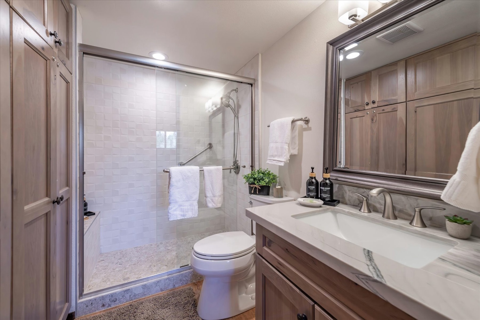 Refresh in your private ensuite bathroom with marble counters, walk-in shower, and thoughtful amenities.