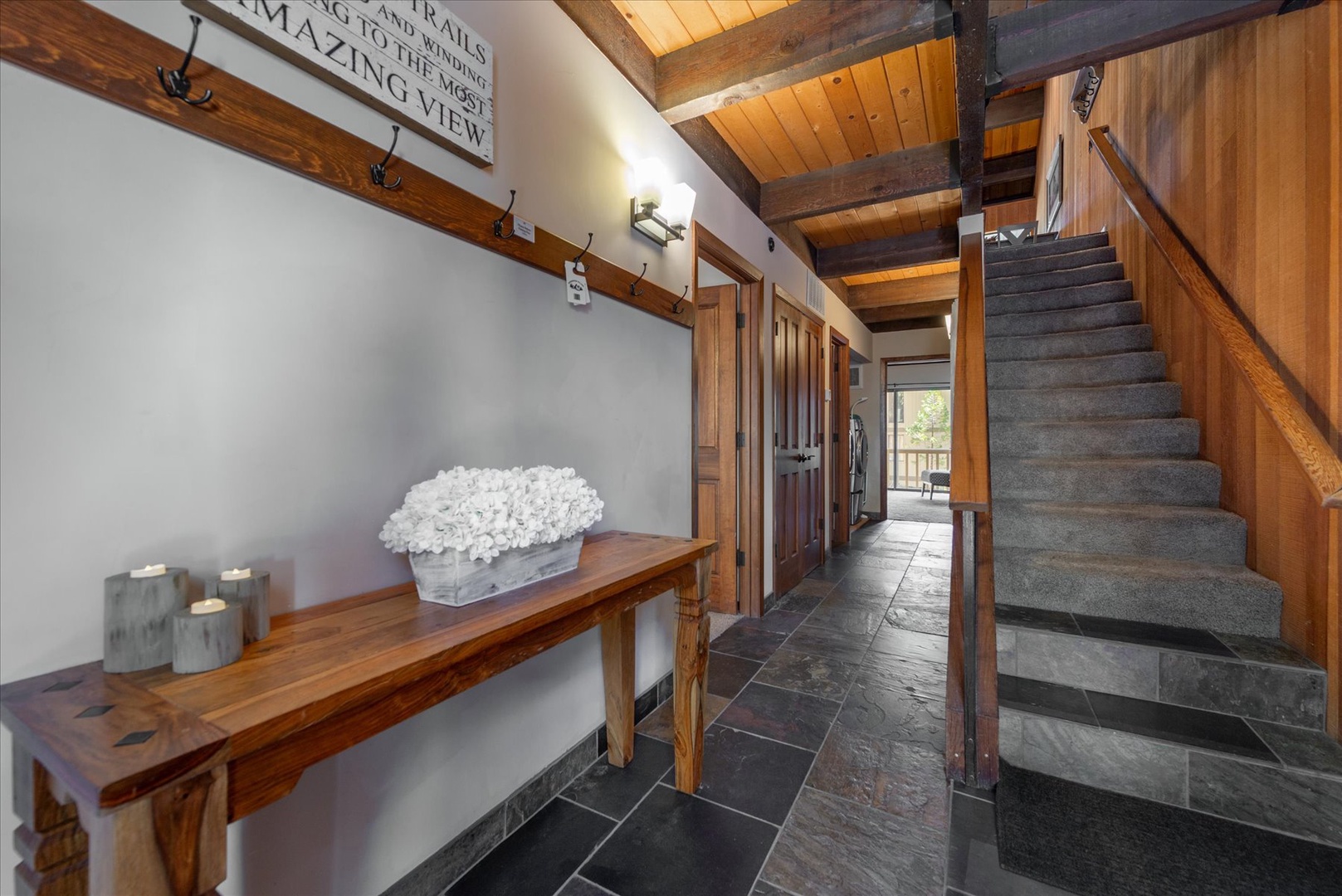 Step into rustic elegance with exposed beams overhead and warm wood accents welcoming you home after your mountain adventures.