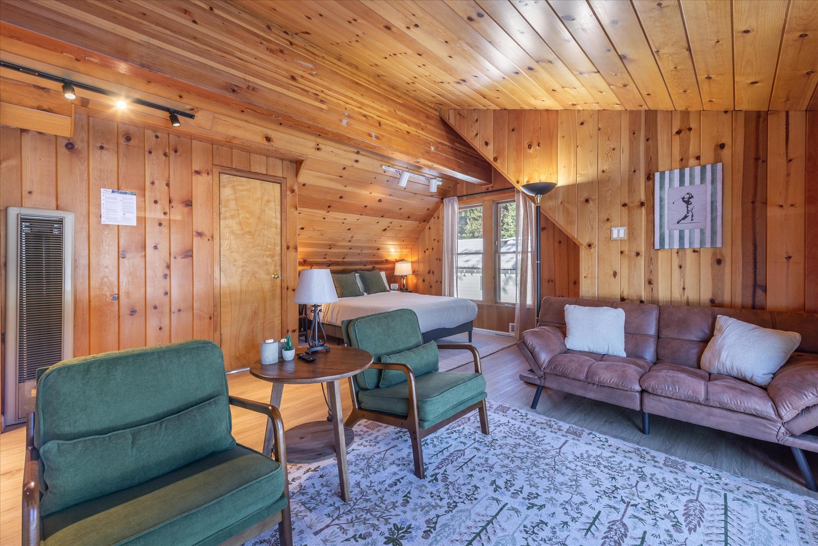 This large master bedroom features a secondary living room and is the perfect place to unwind.