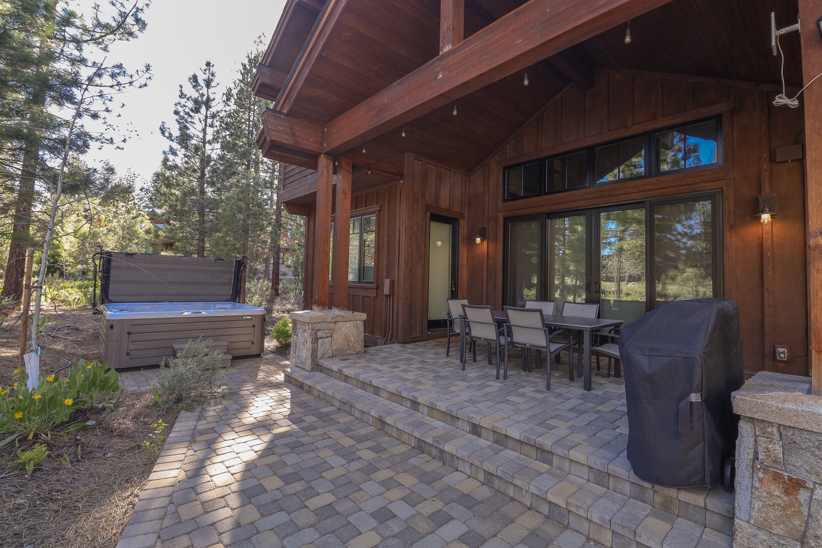 Settle into your private patio surrounded by towering pines. Fire up the grill, soak in the hot tub, and dine alfresco under wide mountain skies.
