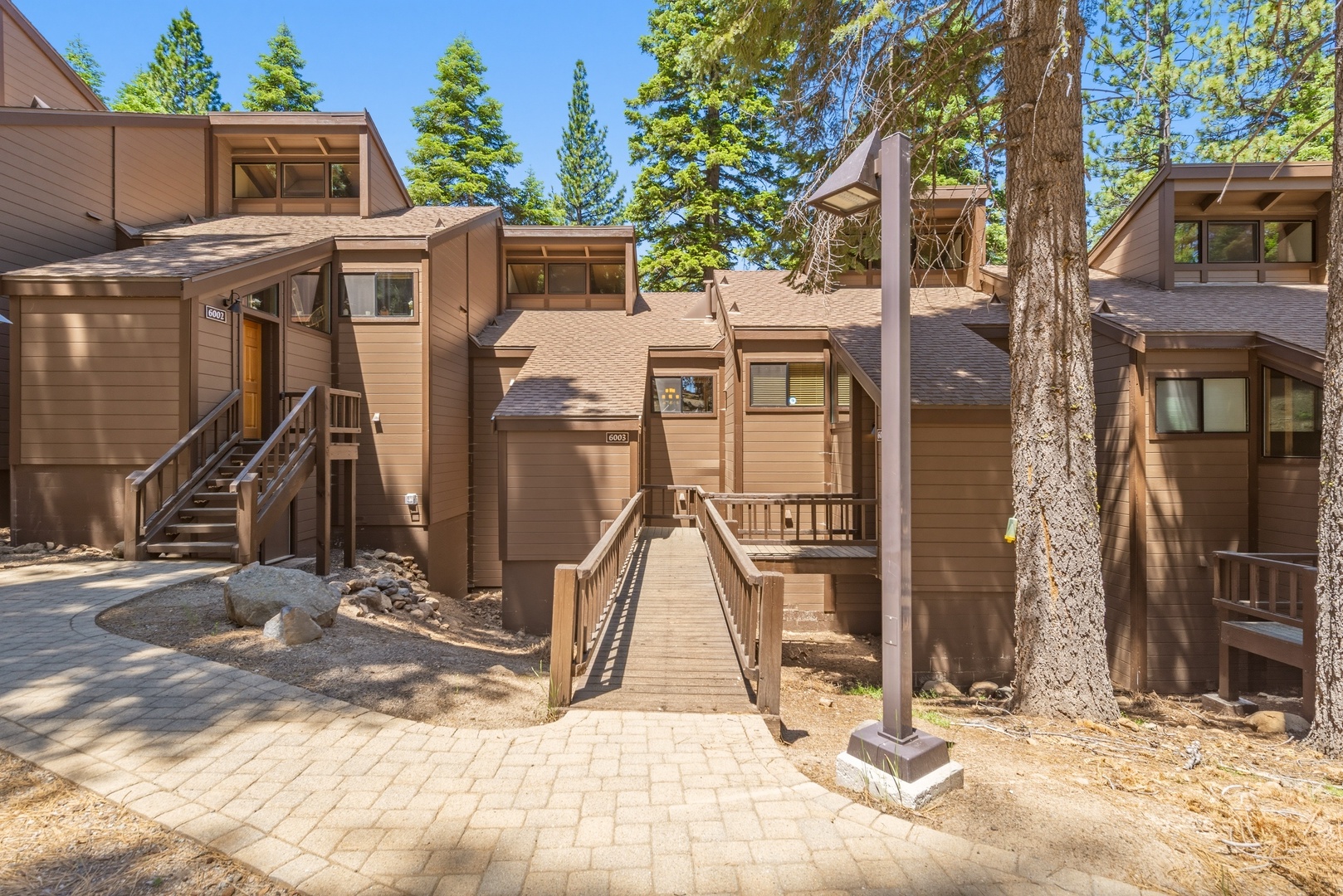 A charming mountain lodge nestled among towering pines, offering a secluded forest retreat with natural beauty just steps from your door.