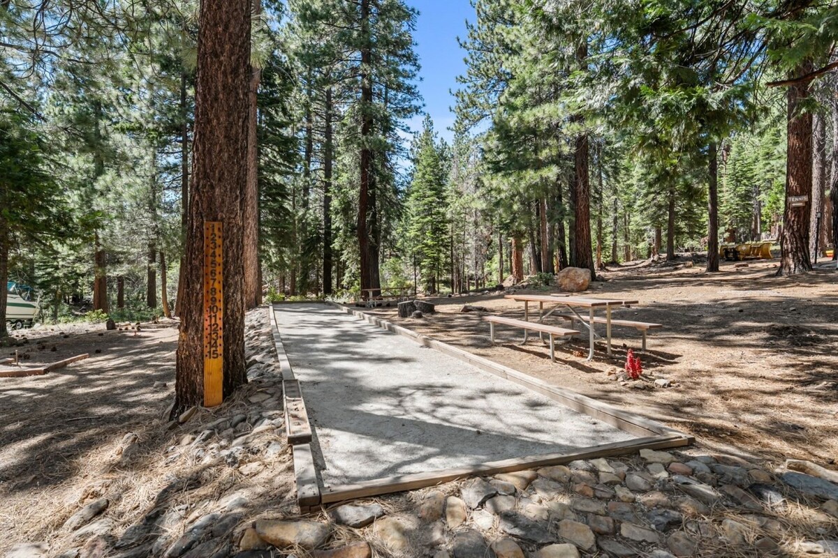 A peaceful forest bocce ball court, bring your own equipment or check some out from the pool attendant!