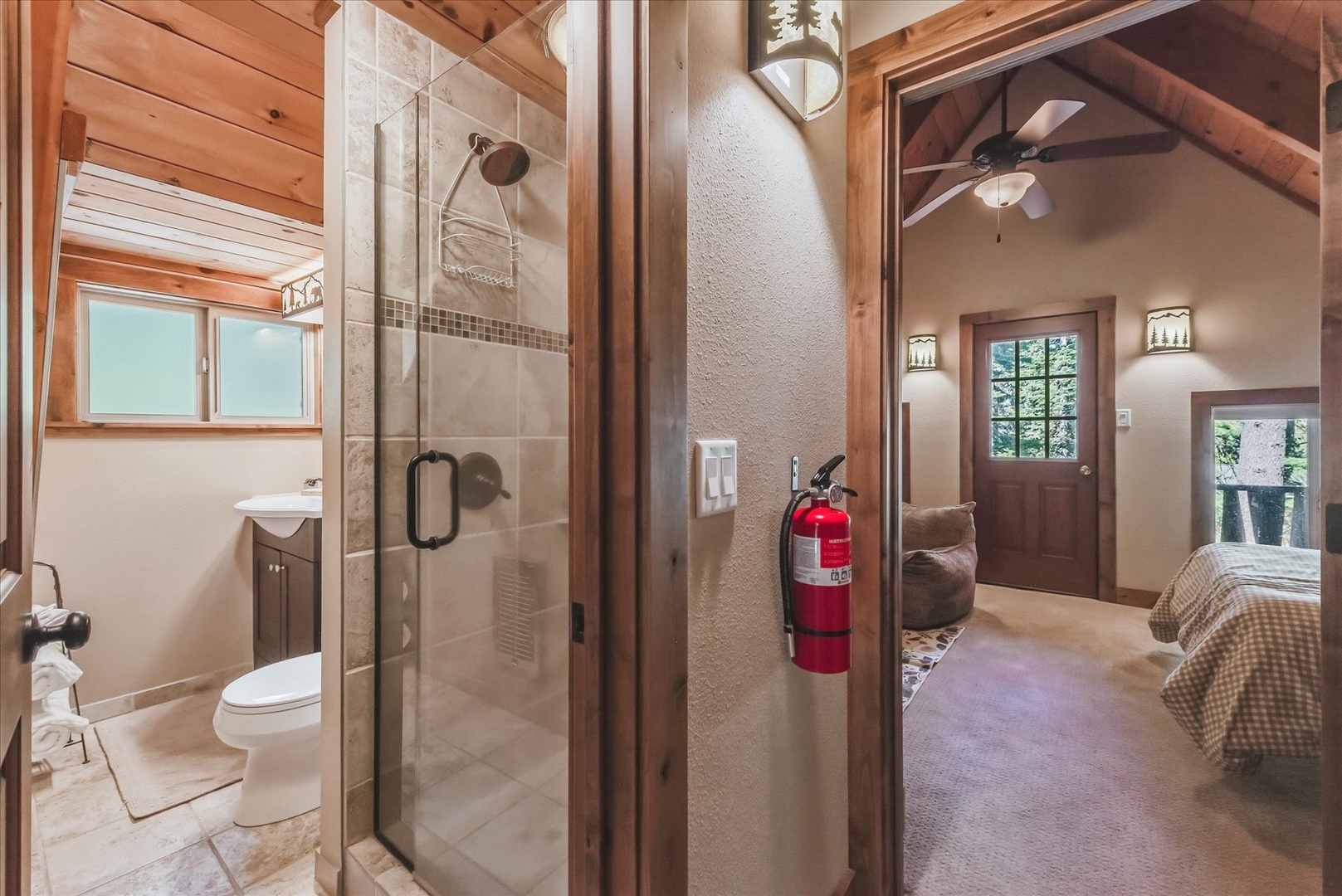 The upstairs bathroom is conveniently located in the hallway between the two bedrooms.