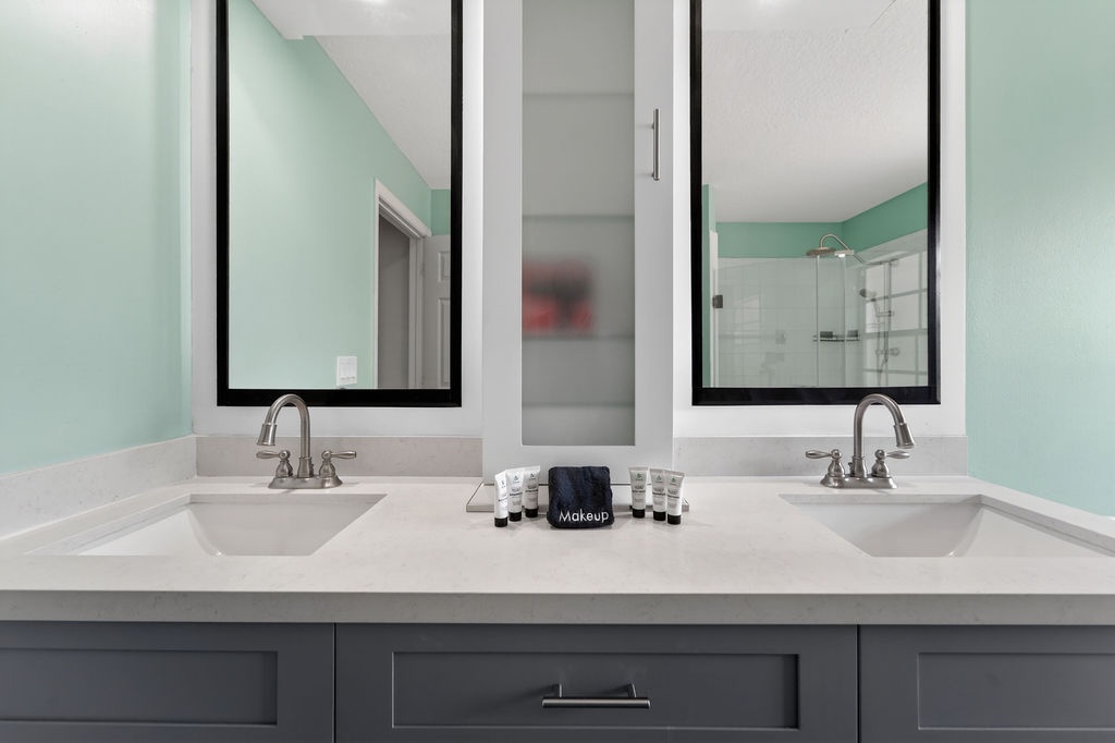 Refresh together in your spacious dual-sink bathroom with sleek design, elegant mirrors, and thoughtful amenities for comfortable mornings.