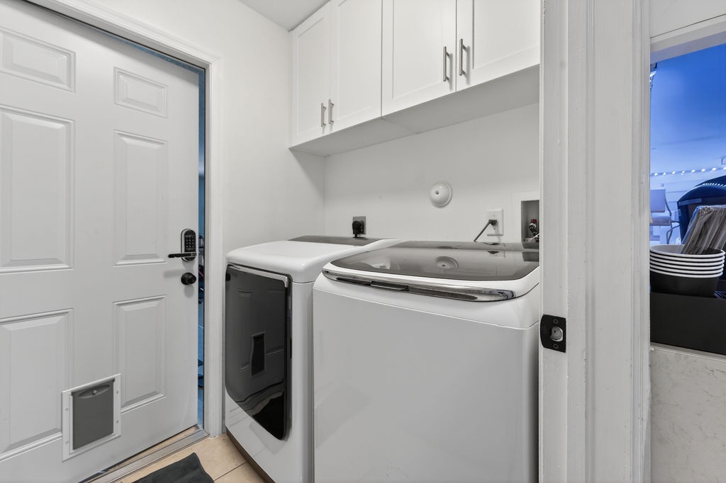 Your dedicated laundry space features full-size washer and dryer with convenient upper storage for all your vacation needs.
