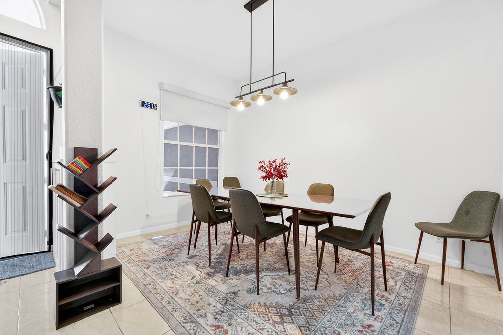 Gather around your stylish dining table for memorable meals with loved ones in this bright, modern space.