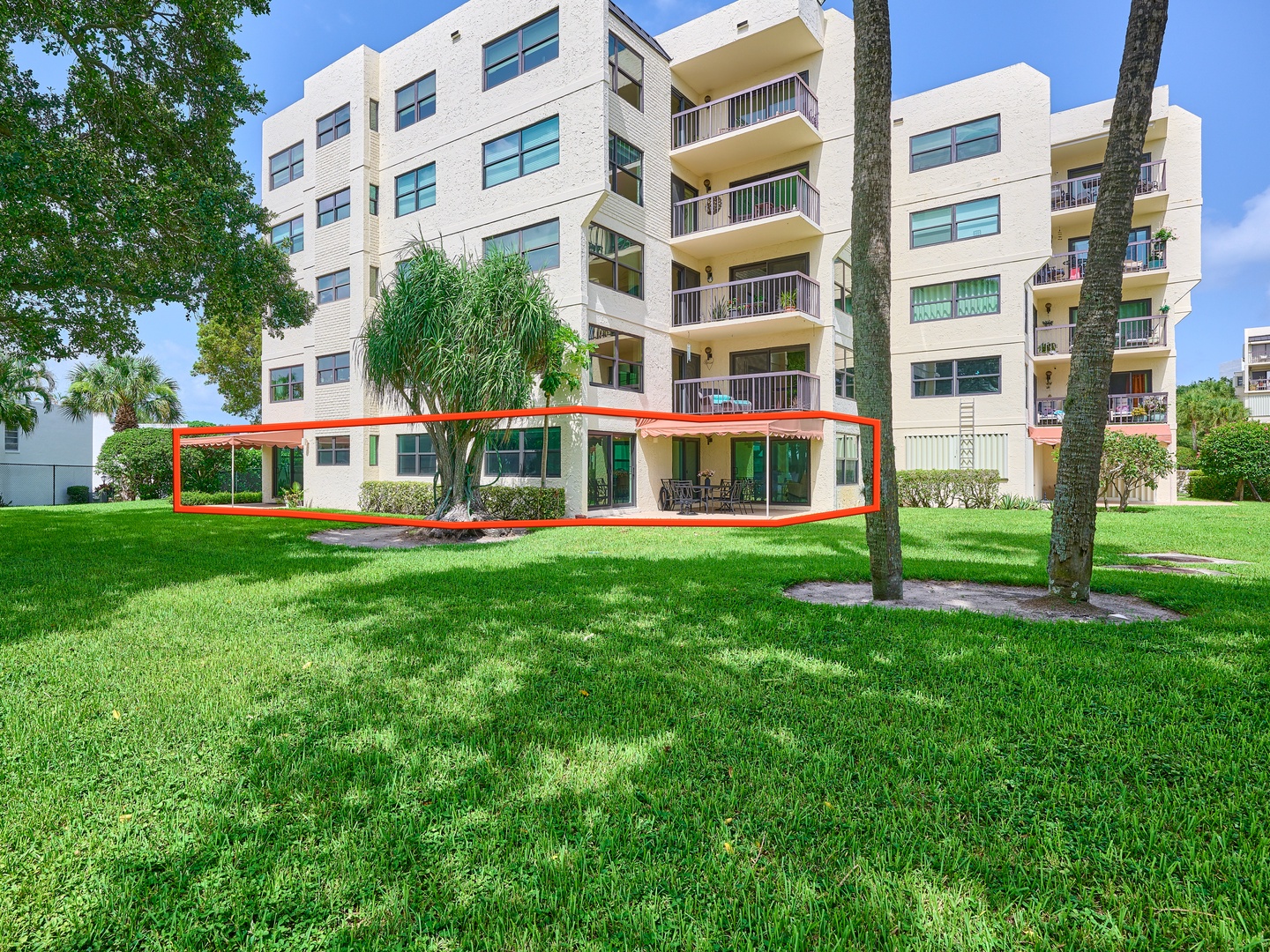Ground-floor unit with direct access to lush lawn areas and a private patio—your tropical retreat awaits.