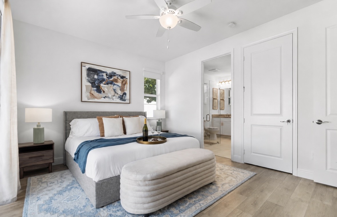Unwind in your bright, airy bedroom with a plush bed and soft coastal touches—your peaceful retreat after a day of exploring.