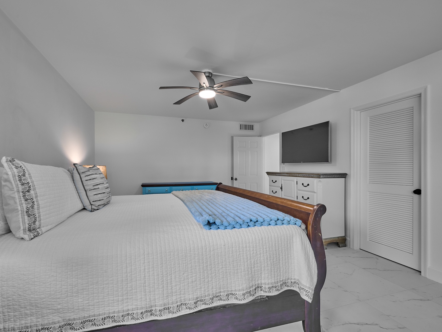 Unwind in your serene bedroom sanctuary with a plush queen bed, gentle ceiling fan, and modern entertainment at your fingertips. Ample storage keeps your belongings tucked away while you enjoy complete comfort and privacy.