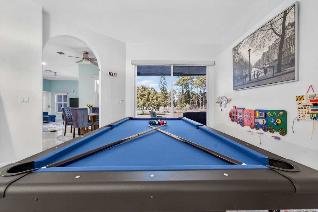 Challenge friends to pool while kids enjoy colorful wall games in your spacious entertainment room.