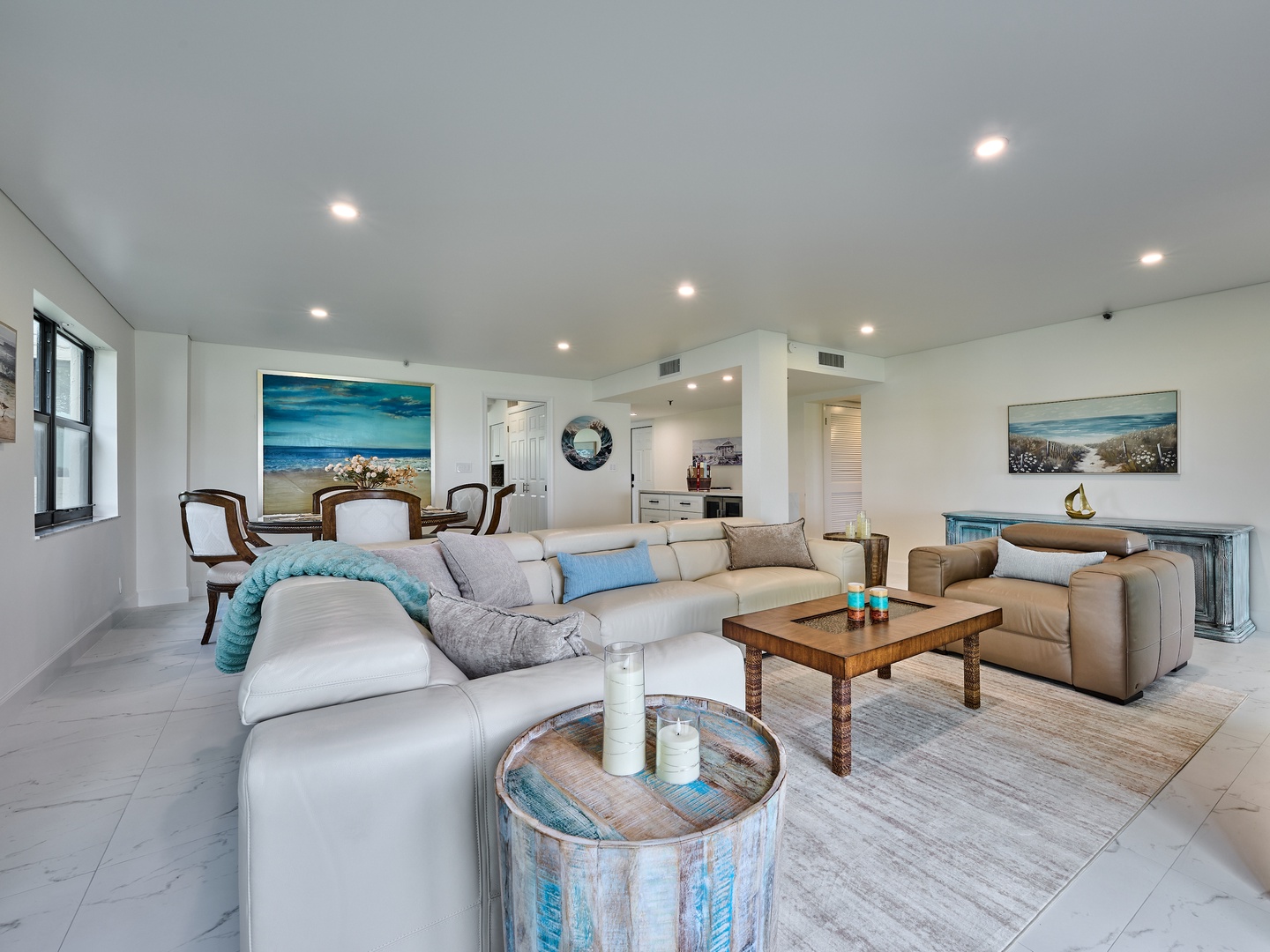 Unwind in your bright, airy living room with plush seating and coastal charm that welcomes you home after a day at the beach.