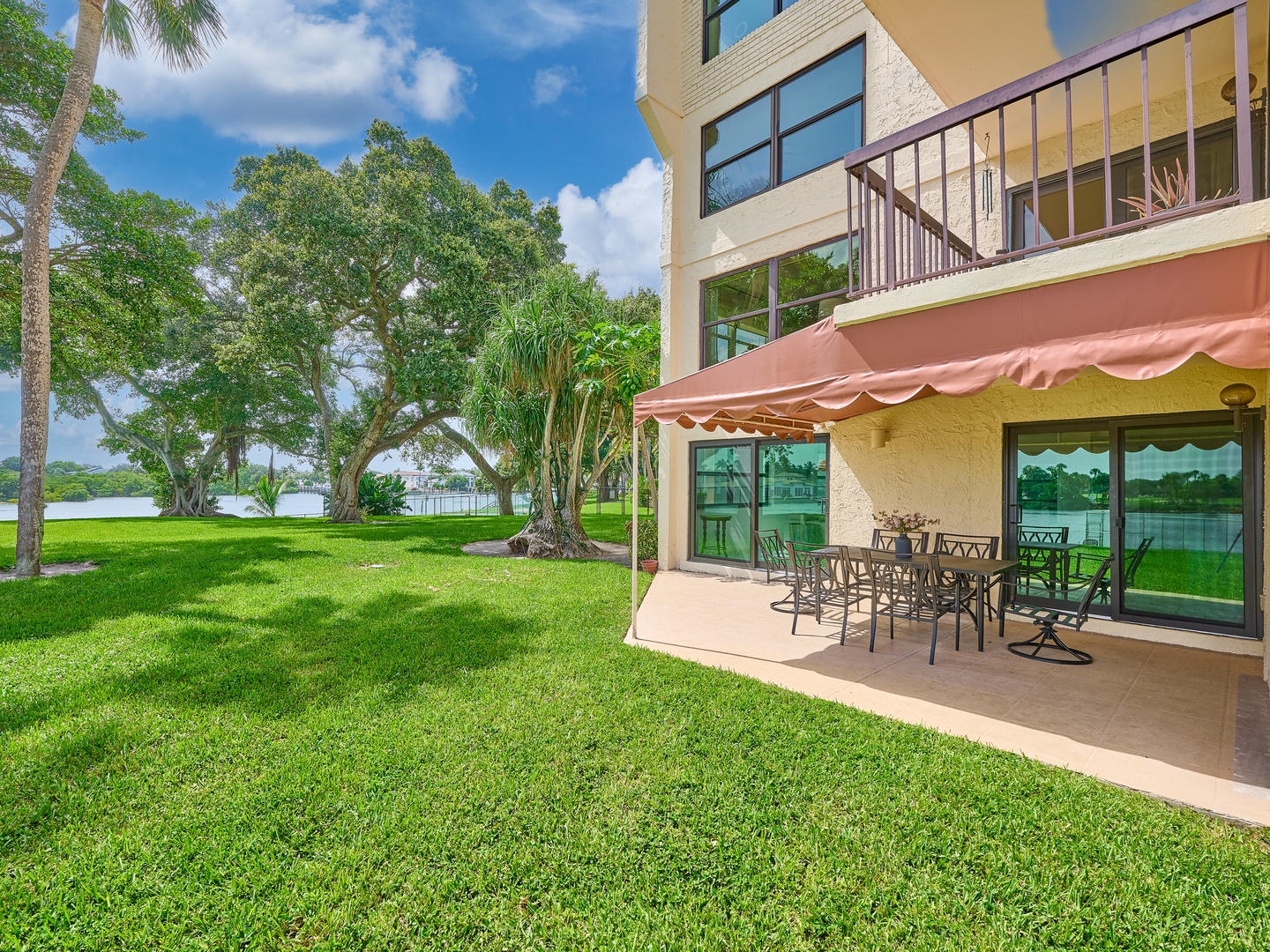 Your private patio opens to lush lawns and tranquil lake views, perfect for alfresco dining or simply soaking in the Florida sunshine.