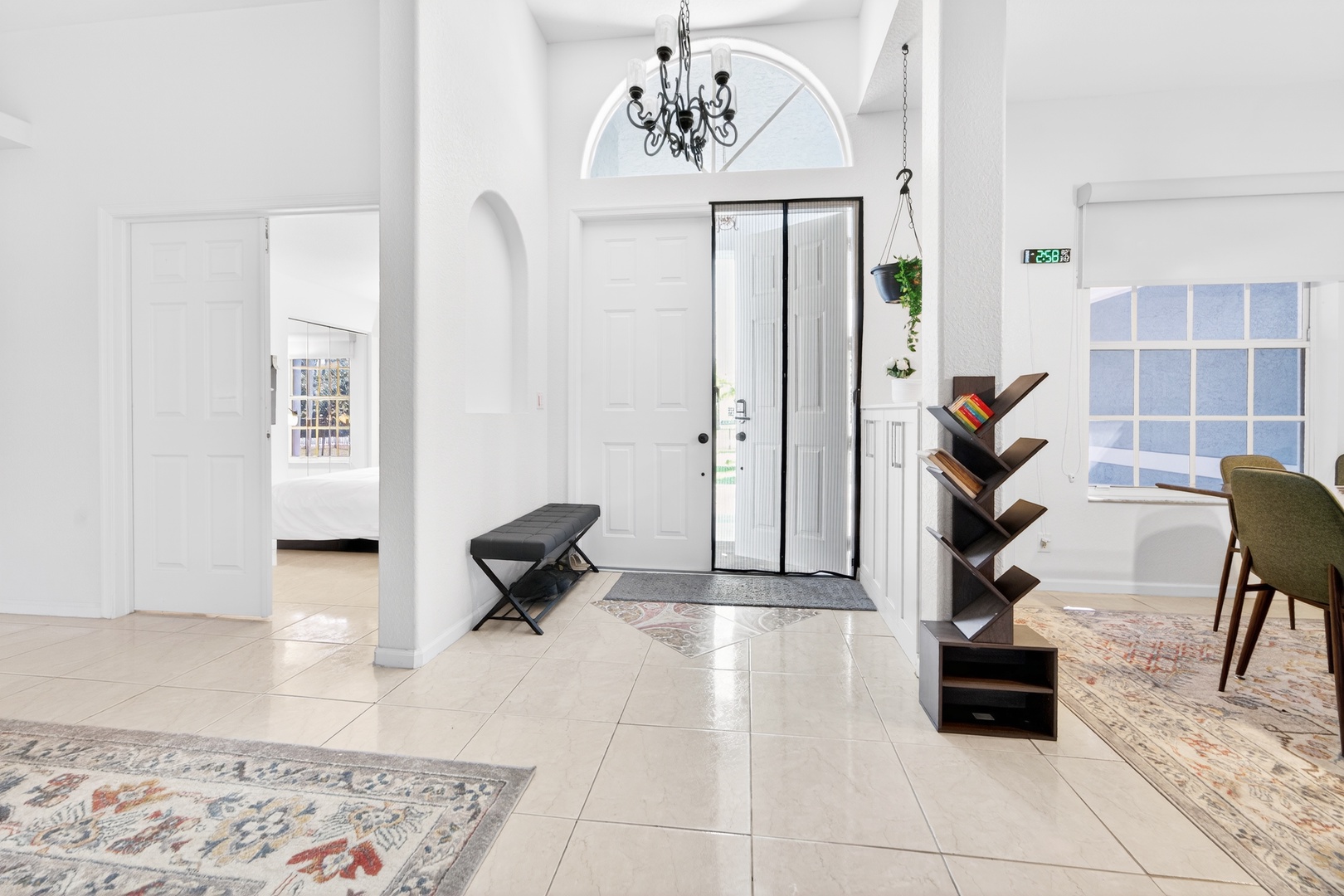 Step into your elegant entrance where soaring ceilings and marble floors create an instantly welcoming atmosphere for your stay.