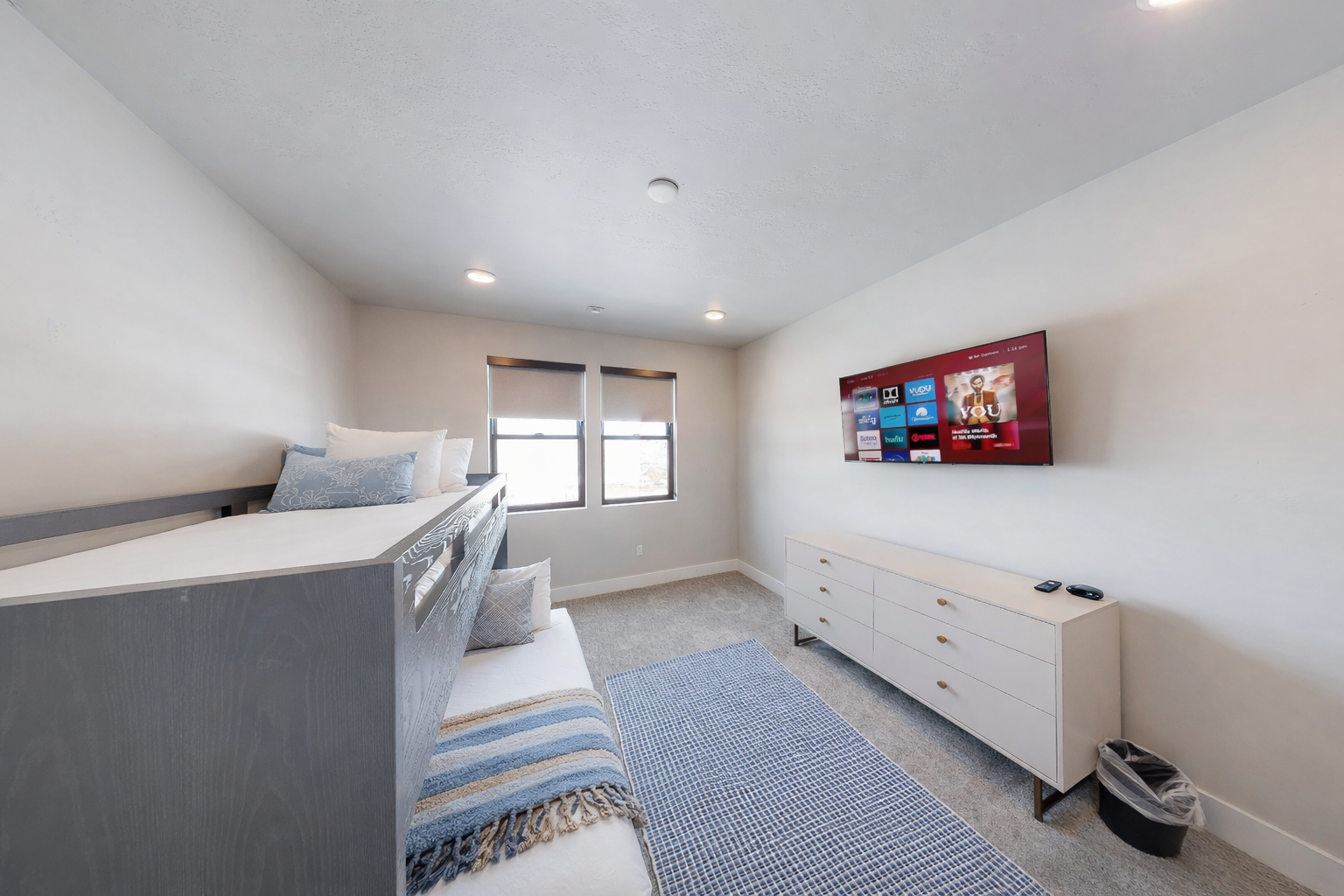 Unwind in your bright bedroom featuring modern bunk beds, smart TV entertainment, and ample storage for all your vacation essentials.