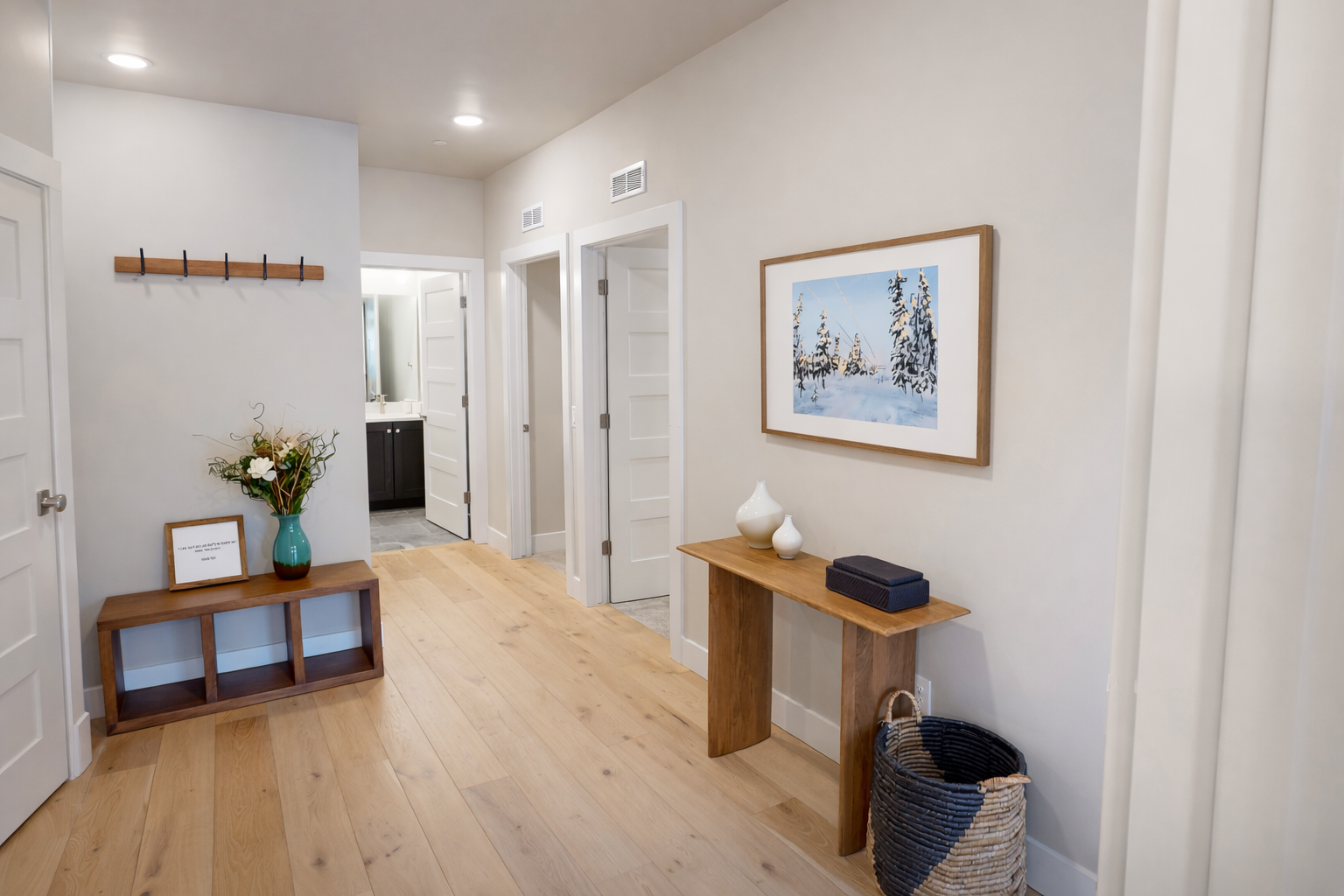 Experience sophisticated modern living in this beautifully designed entryway that sets a serene tone for your Park City retreat. This inviting space features a sleek minimalist aesthetic, highlighted by warm wood tones and clean architectural lines