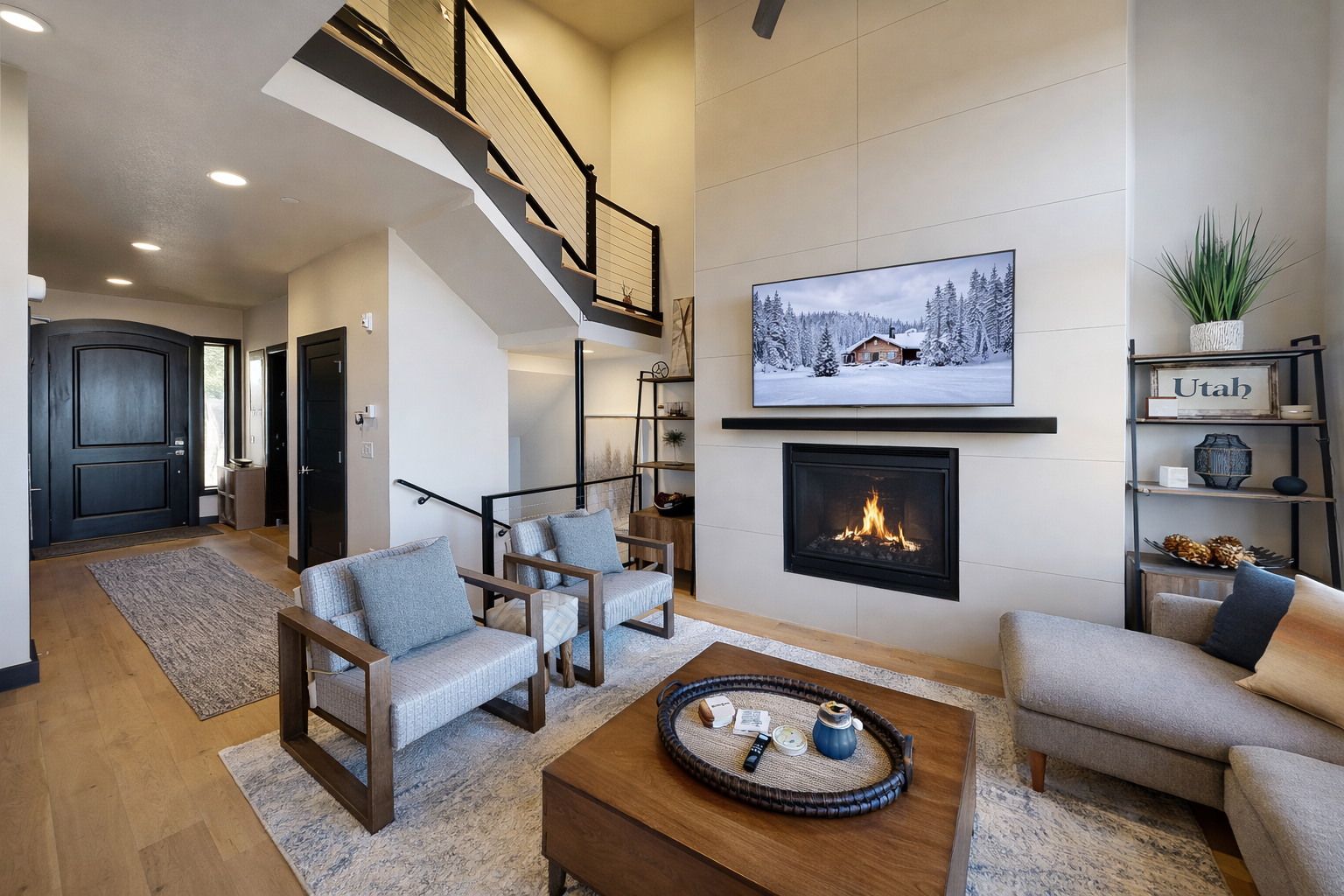 Cozy up by the fireplace in your stylish living room with stunning mountain views and modern comfort.