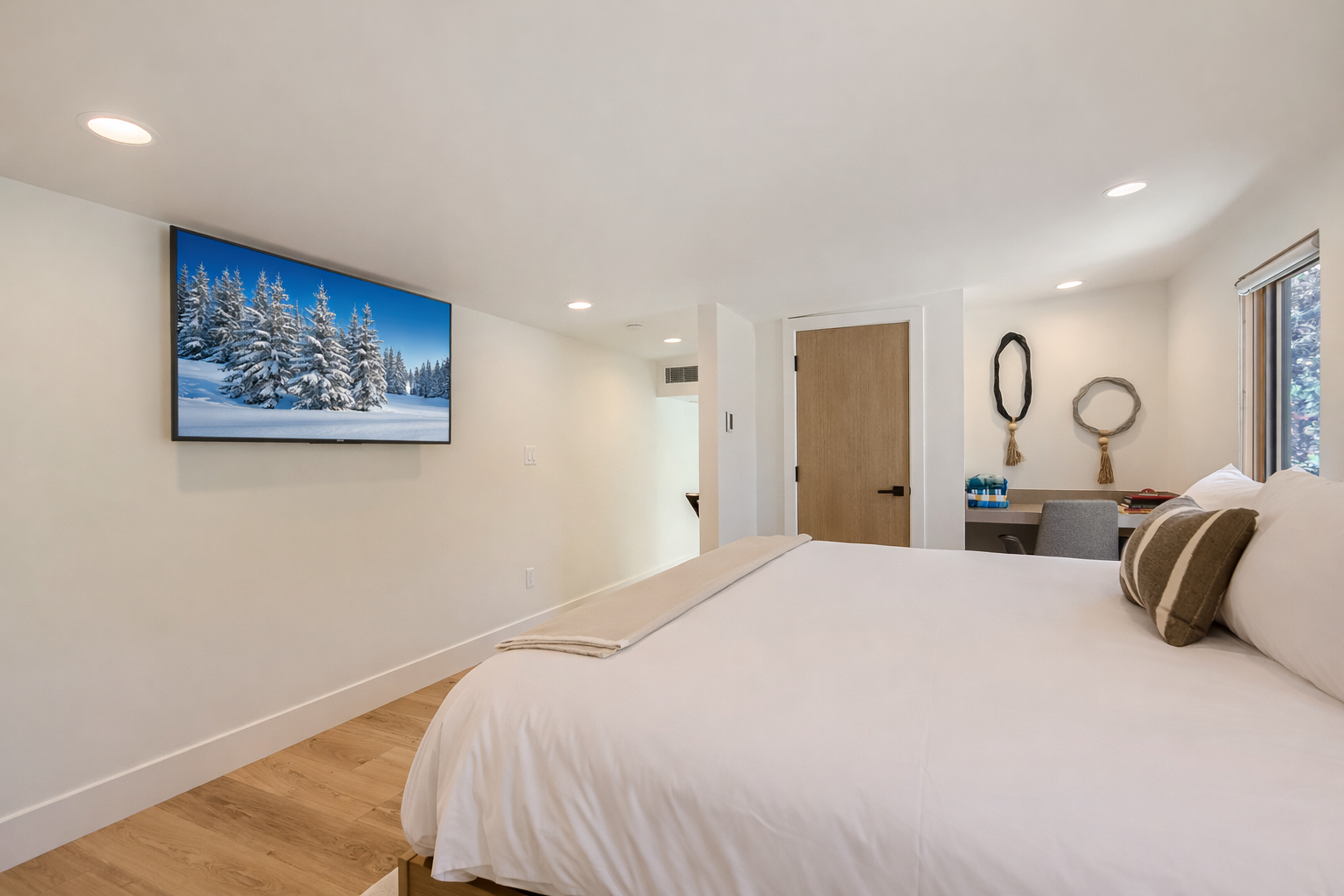 Retreat to the elegant mother-in-law suite featuring a plush king-size bed and a private, modern ensuite bathroom.