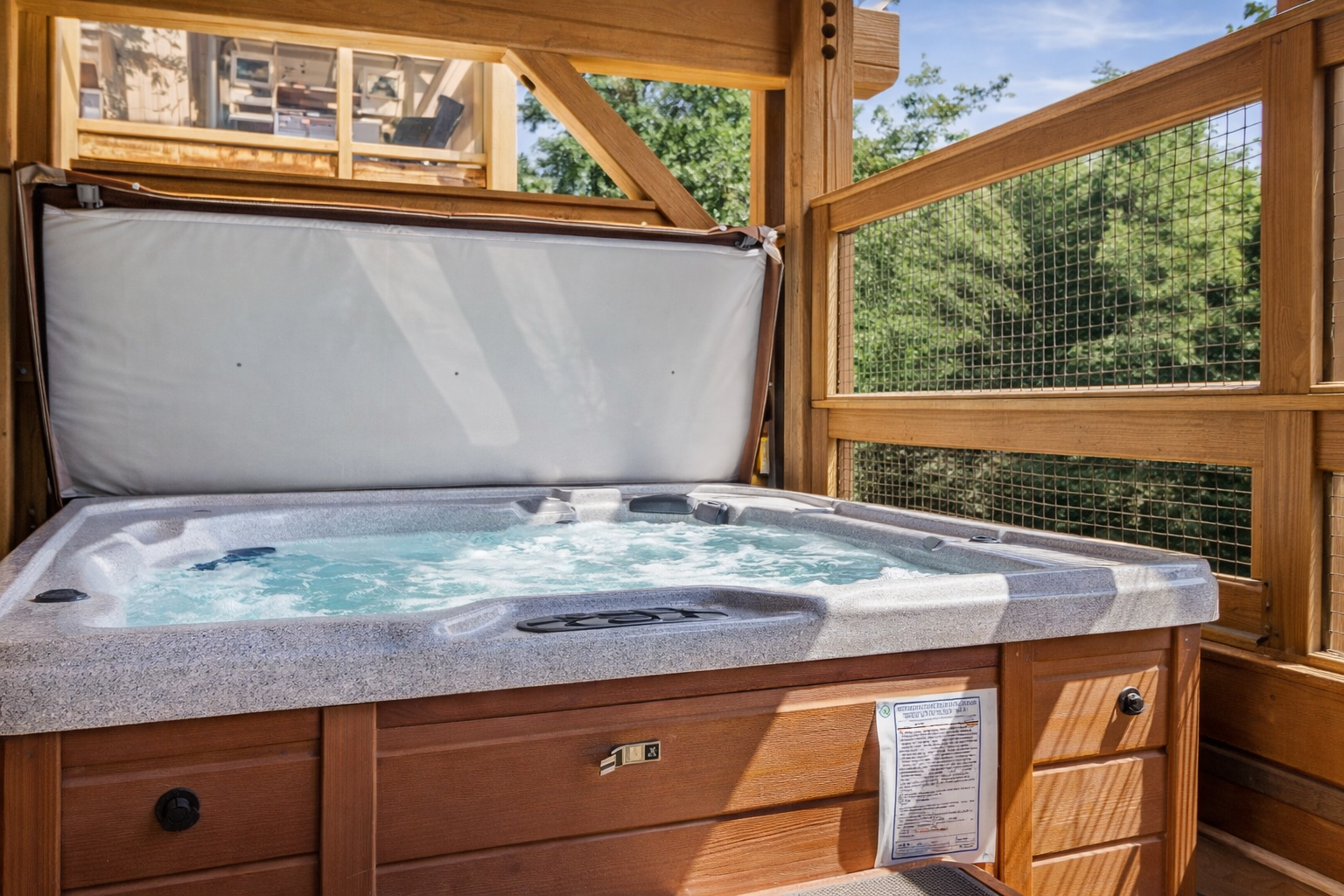 Soak your cares away in your private hot tub, surrounded by warm wood and peaceful views.