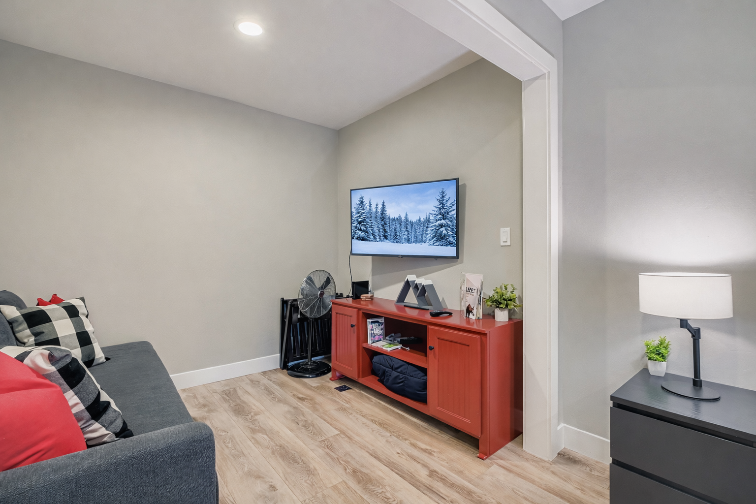 Retreat to this cozy bedroom featuring a comfortable queen and twin bunks and TV. The Park City decor creates a perfect mountain getaway.