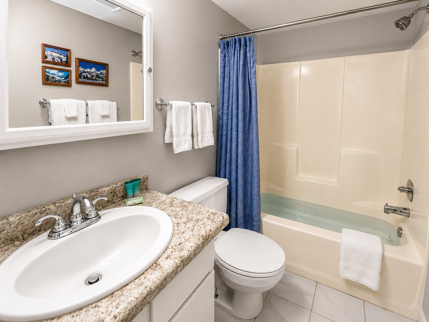 Refresh in your private bathroom with a granite vanity, tub/shower combo, and plush towels—everything you need for a relaxing stay.