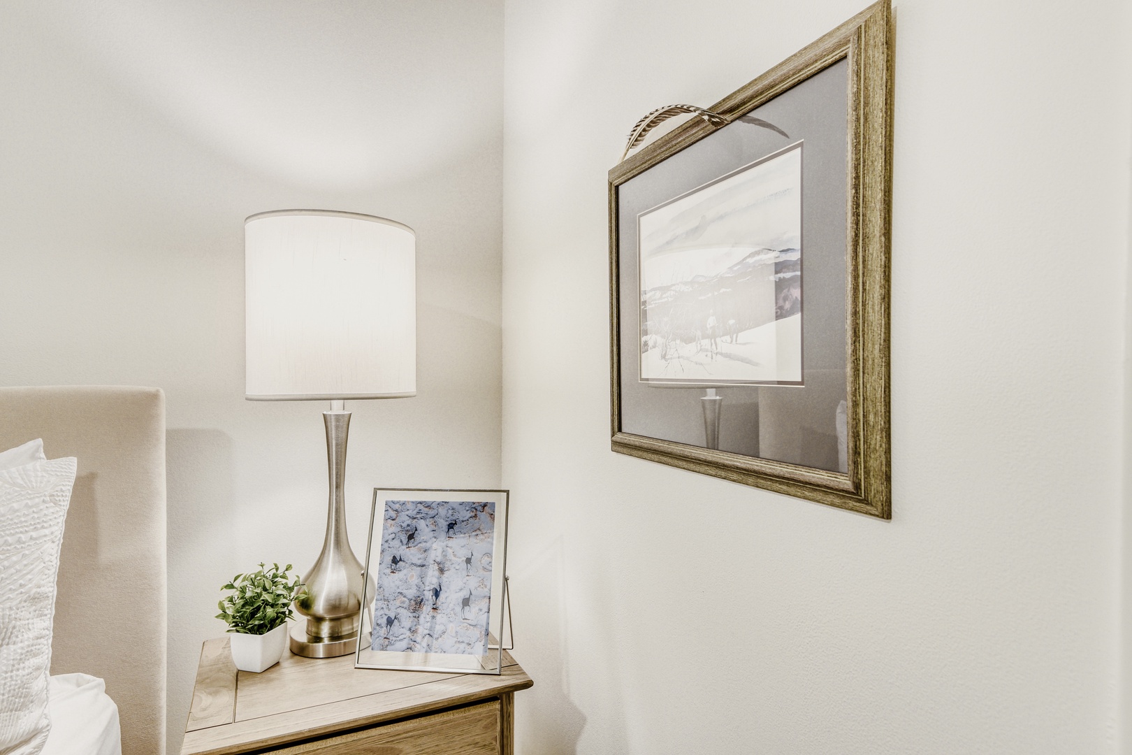 Unwind in your elegantly styled bedroom corner, where warm lighting and thoughtful touches create the perfect retreat.