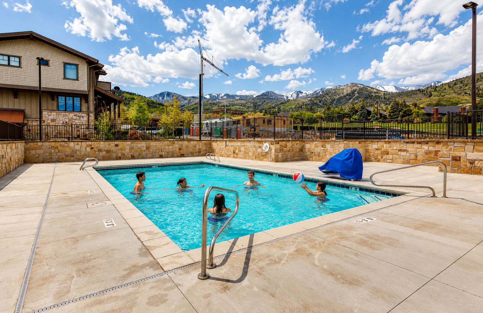The outdoor pool offers stunning mountain views and a refreshing space to unwind. Sparkling water and sunny skies create the perfect setting for relaxation and fun.