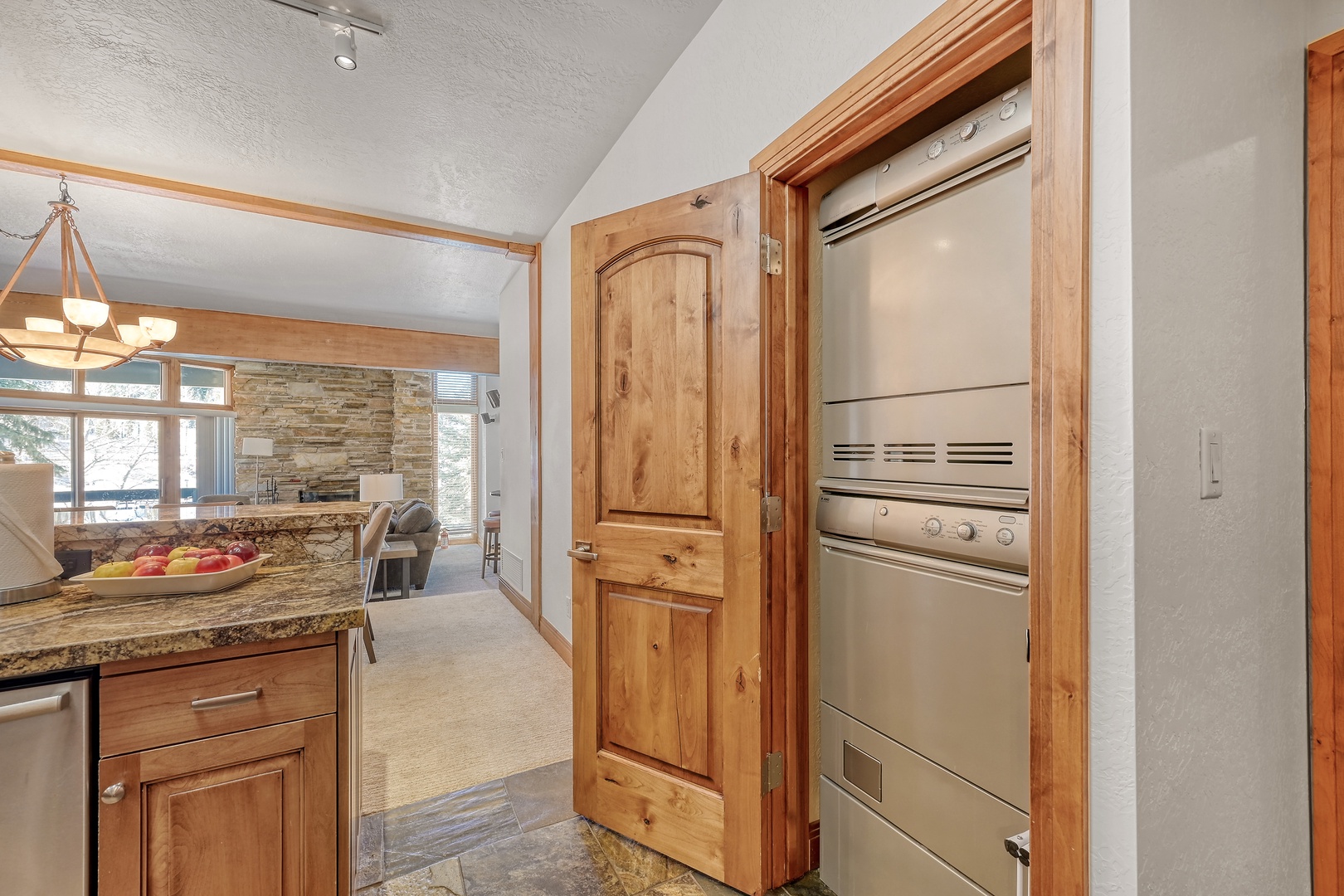 Your beautifully appointed kitchen features stainless steel appliances and warm wood cabinetry, creating the perfect space for preparing memorable meals.