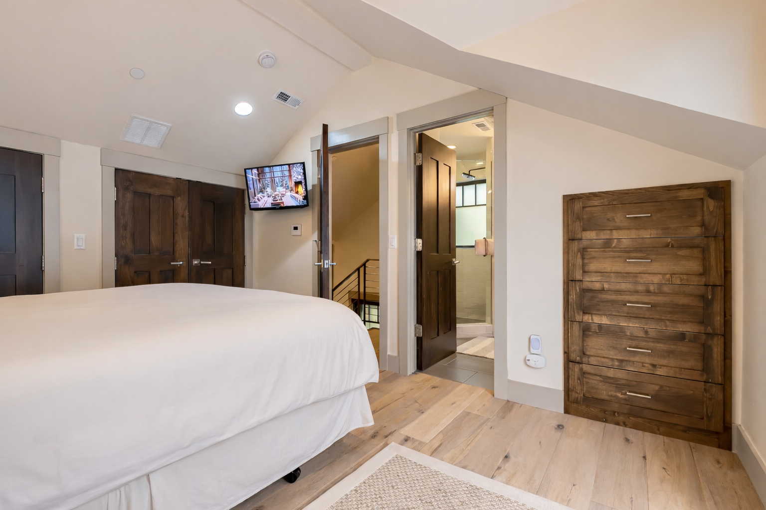 Retreat to your master bedroom where rustic wood finishes meet modern luxury. Crisp linens await your restful nights.