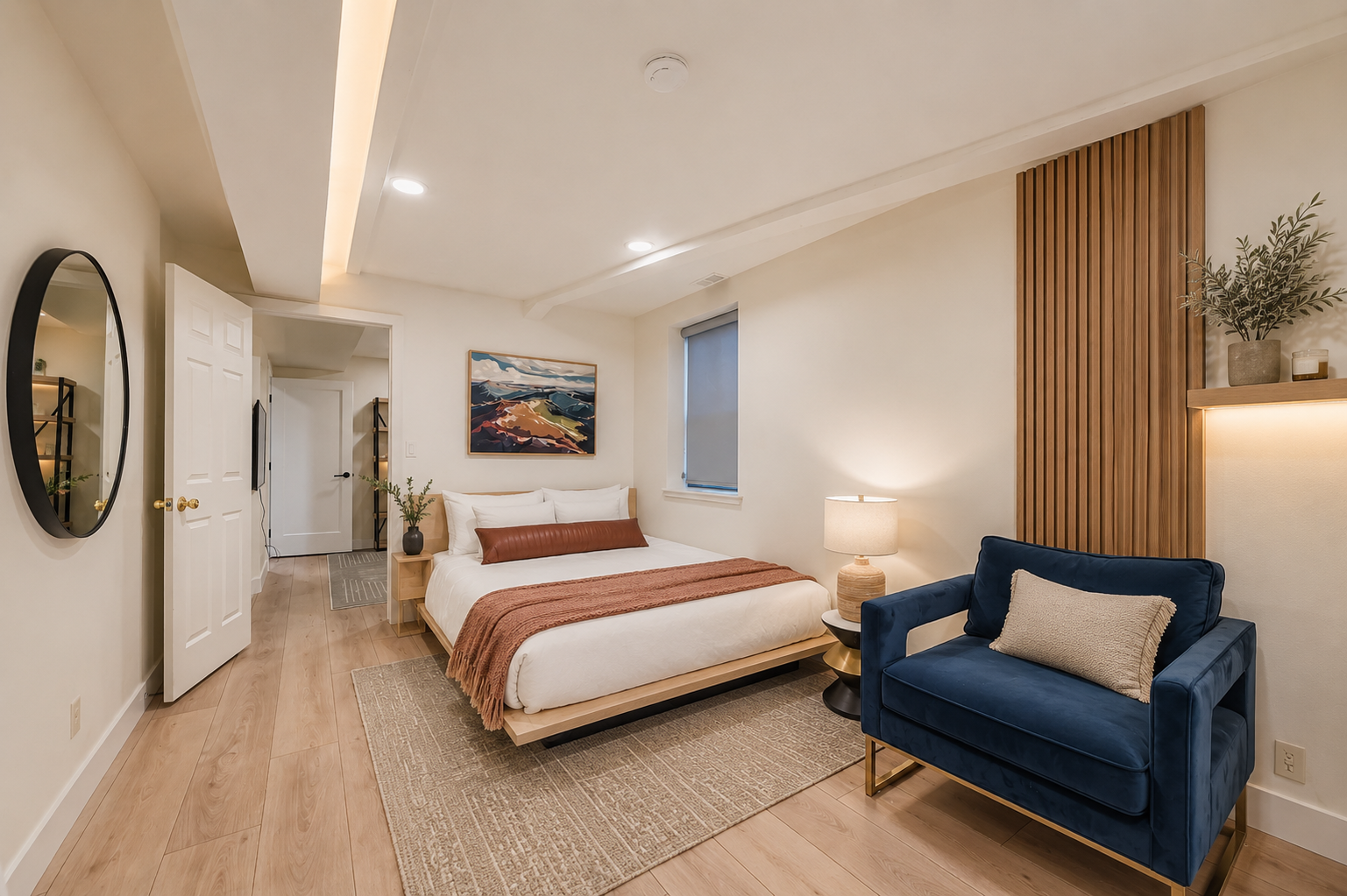 Sink into crisp linens and unwind in your thoughtfully designed retreat, complete with soft lighting, warm wood tones, and a cozy reading nook for quiet moments.