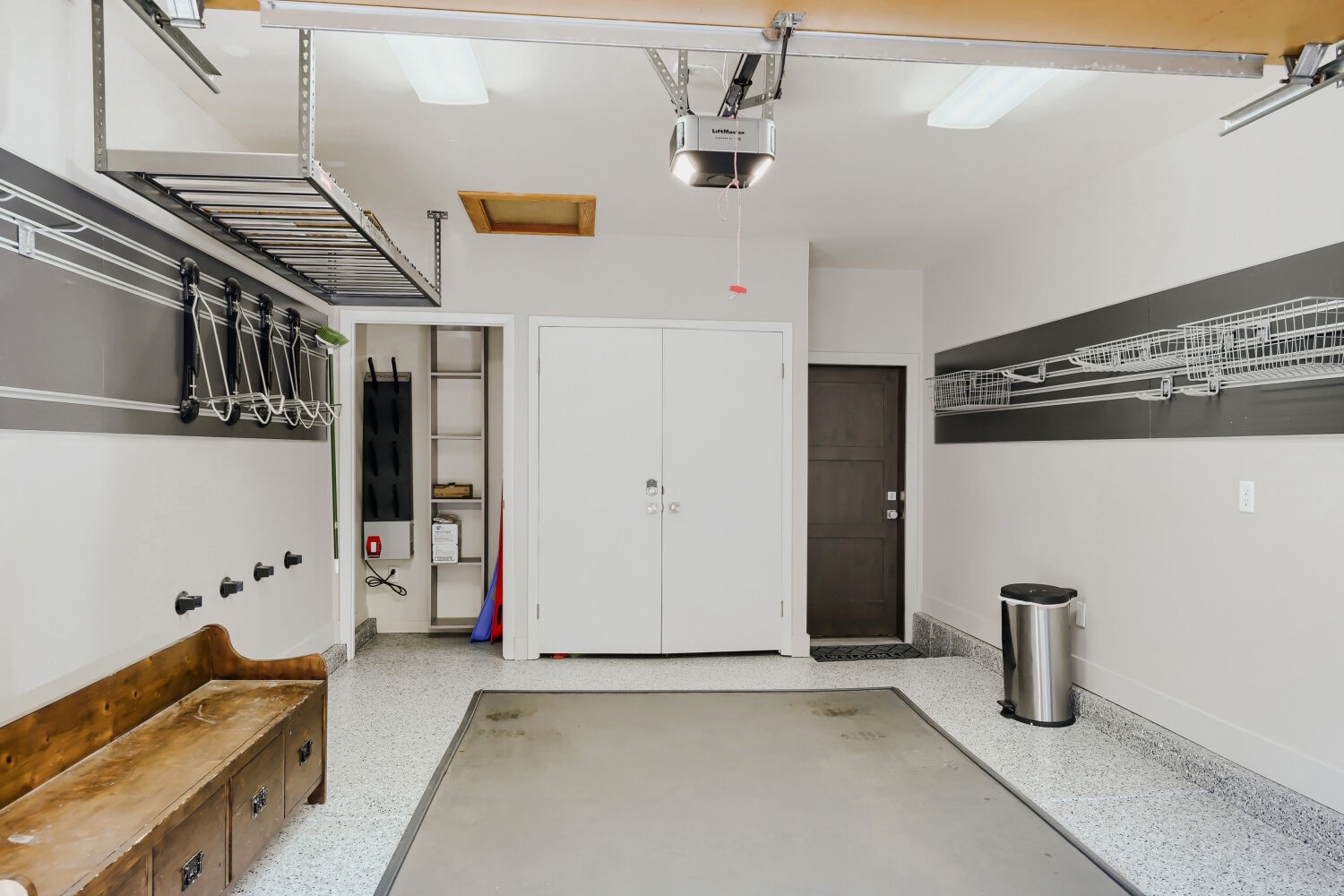 Your private garage features overhead storage racks, wall-mounted hooks, and open shelving to keep your gear organized and easily accessible throughout your stay.