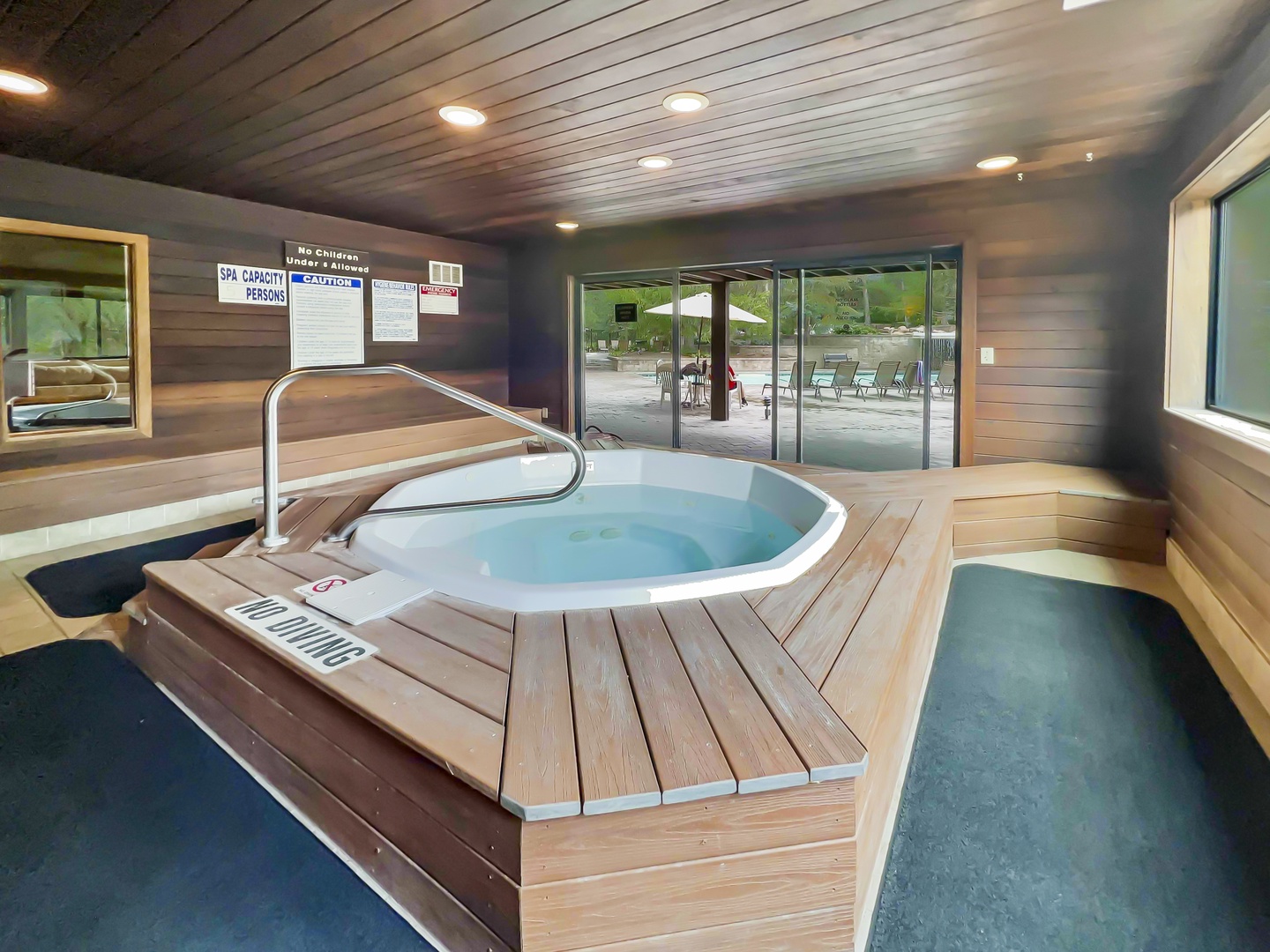 Soak and unwind in the Red Pine community's year-round indoor hot tub! This serene space is surrounded by natural wood decking and windows