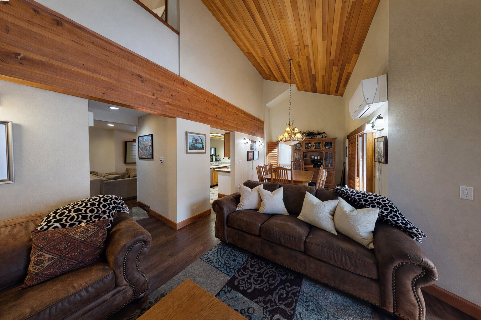 Unwind in your spacious living room with soaring wood ceilings and cozy leather seating perfect for evening conversations.