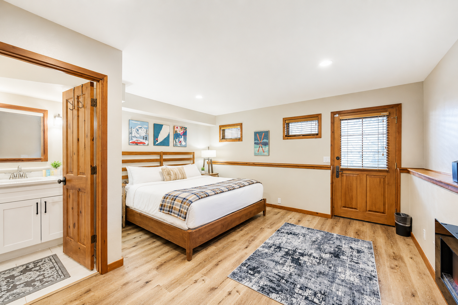 Slip into fresh linens on a handsome wooden bed, where warm wood accents and modern touches create your perfect retreat after a day of mountain adventure.