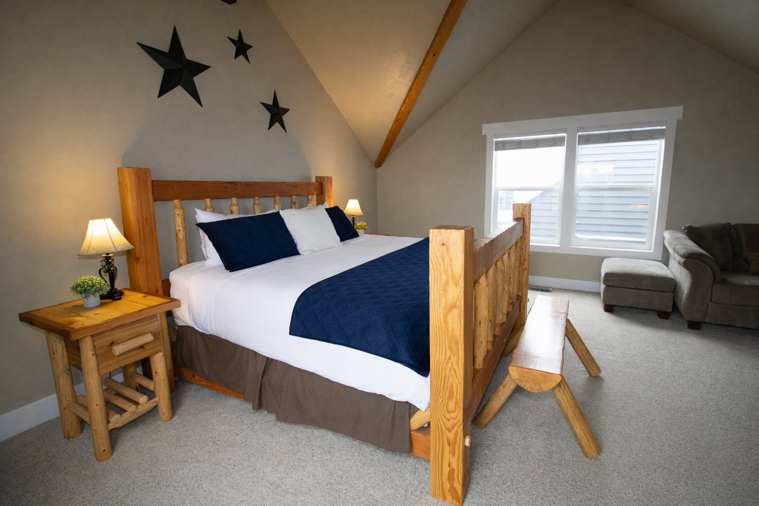 Relax in this spacious master suite on its own private floor. Features include a king-sized log bed, vaulted ceilings, and a large walk-in closet for the ultimate mountain retreat.