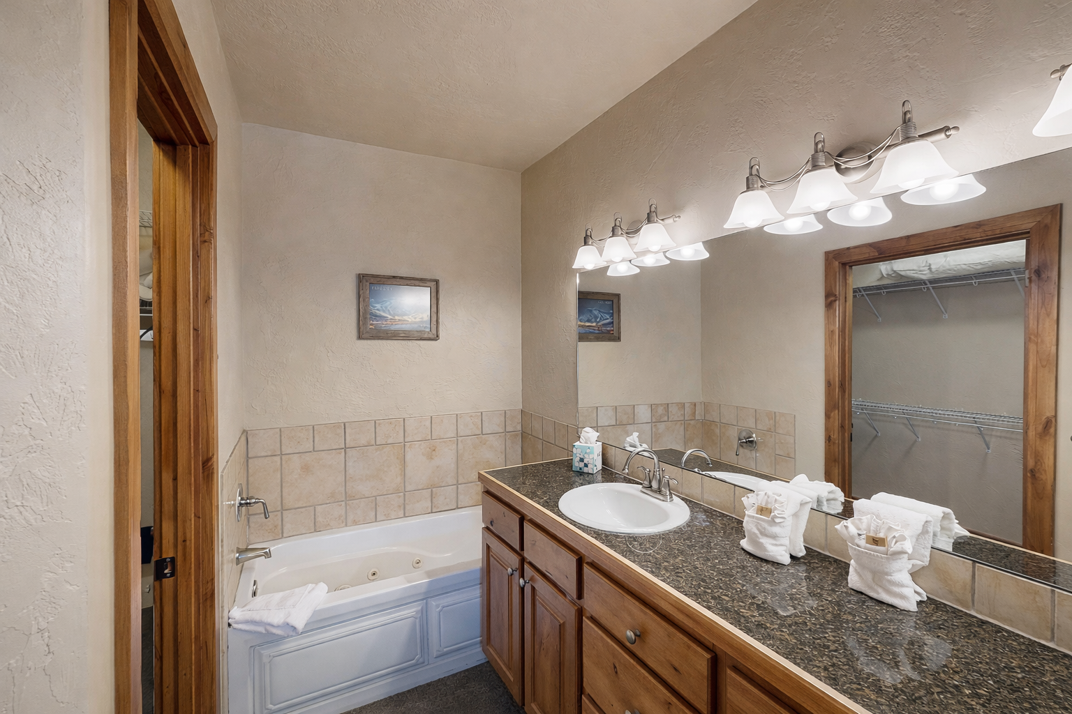 Spacious bathroom featuring a convenient double vanity and a relaxing tub/shower combination. Enjoy ample counter space, storage, and lighting for a seamless morning routine!