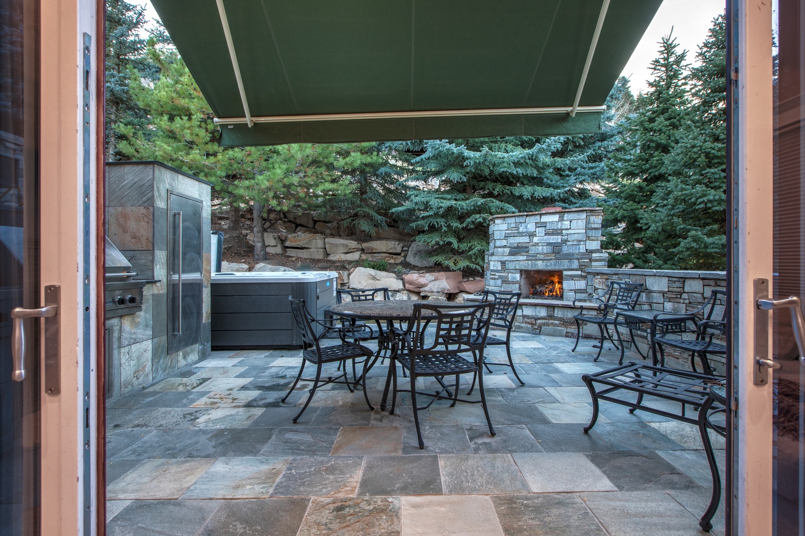 Enjoy year-round comfort with a private hot tub, outdoor fireplace, and a full outdoor kitchen/BBQ area. This true ski-in/ski-out gem is also a short walk from Main Street shops and dining.