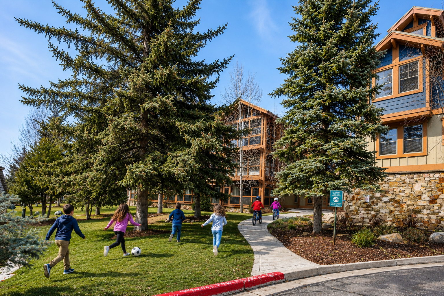 Mountain resort buildings nestled among snow-dusted evergreens create a picturesque alpine setting for your winter getaway.