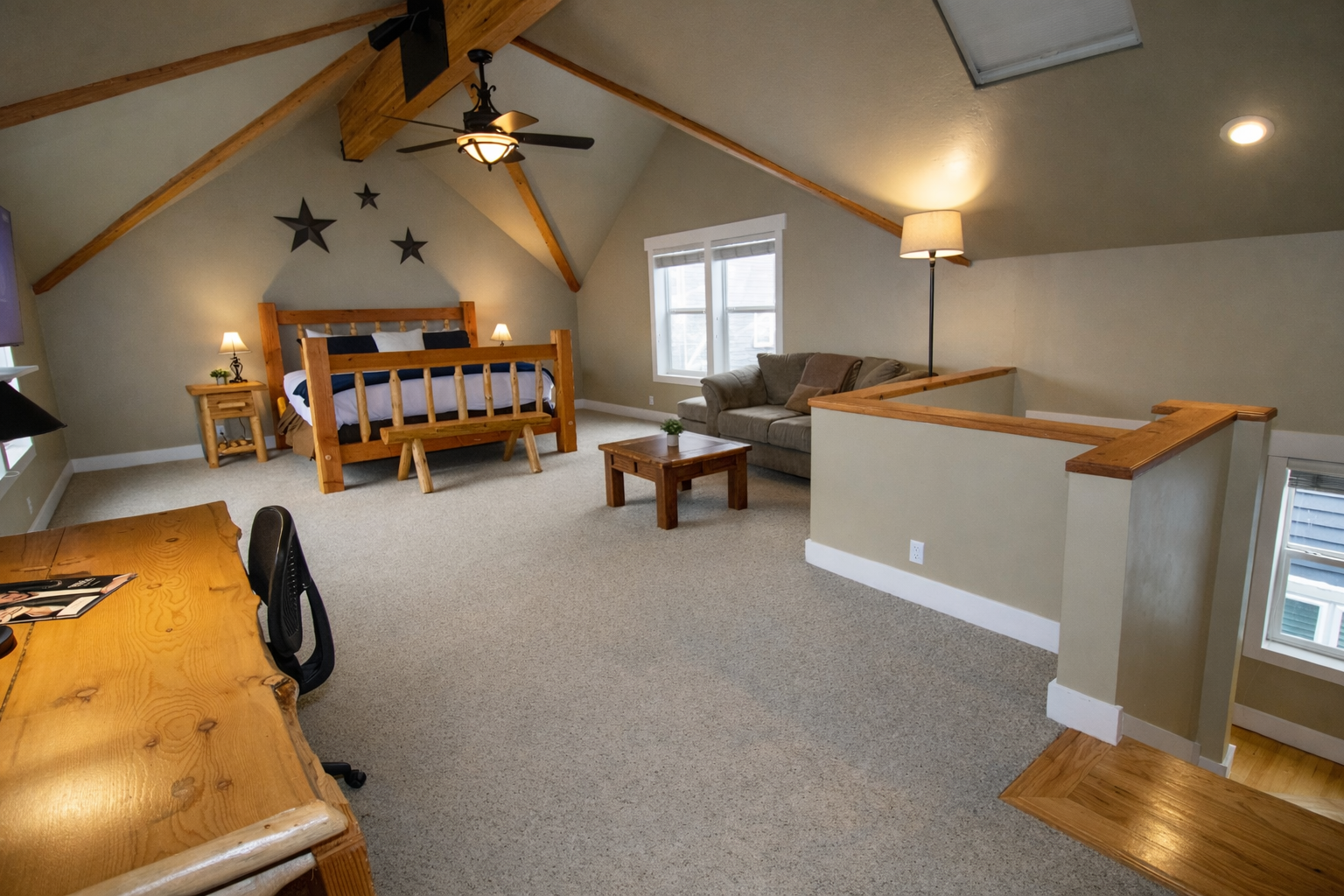 Relax in this spacious master suite on its own private floor. Features include a king-sized log bed, vaulted ceilings, and a large walk-in closet for the ultimate mountain retreat.