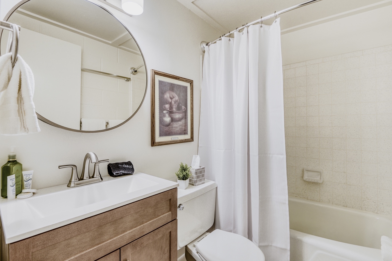 Step into your private sanctuary with modern vanity, soaking tub, and thoughtful touches that make freshening up a pleasure.