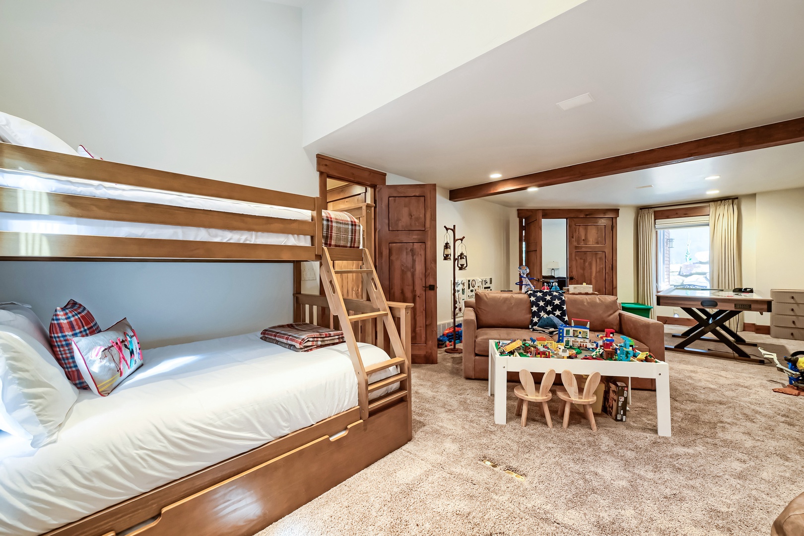 Oversized Bunk Beds with Relaxing Couch with TV and Games for the Kids